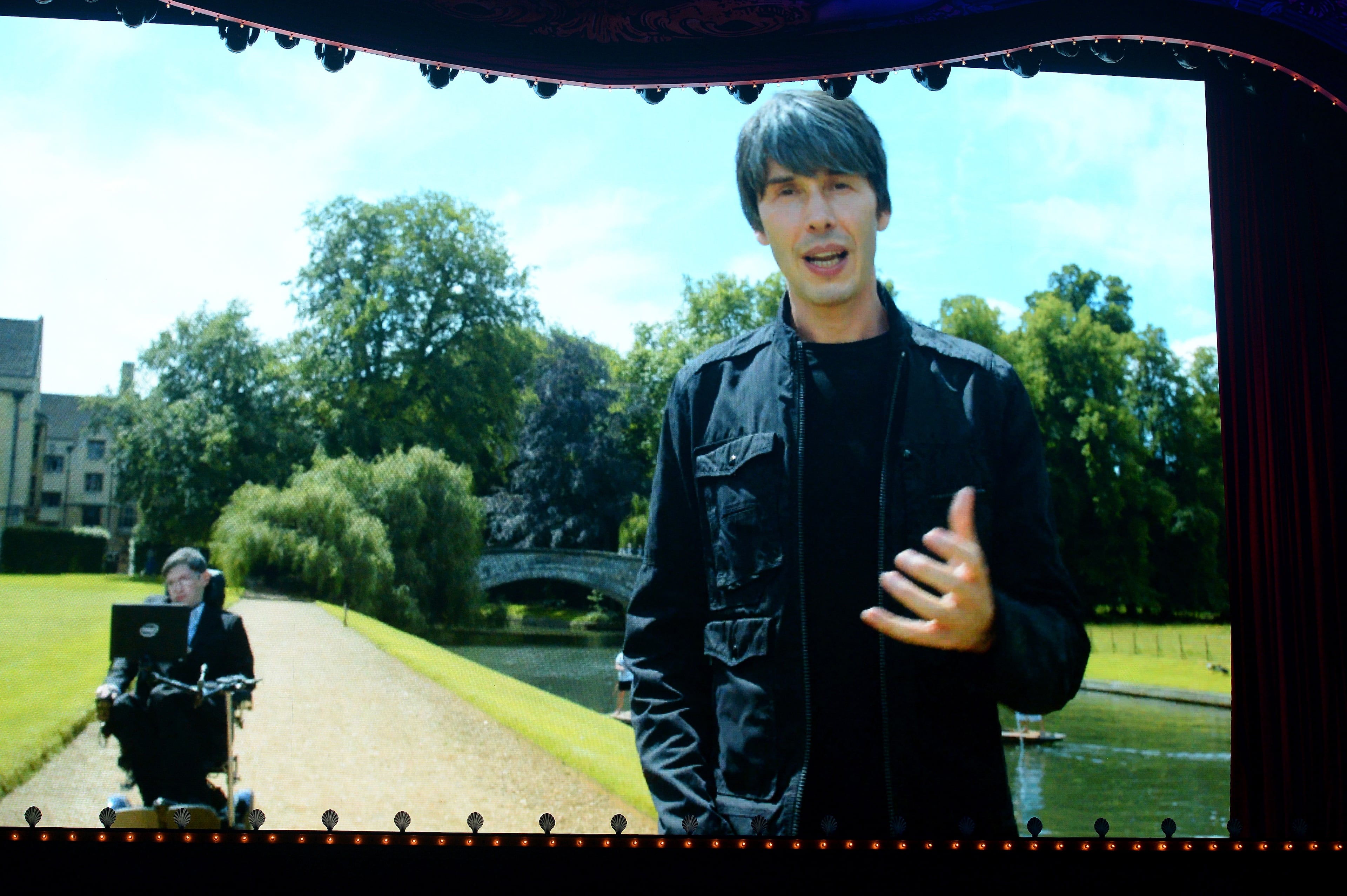 LONDON, ENGLAND - JULY 01: (EXCLUSIVE COVERAGE) General view of the screen showing physicists Stephen Hawking and Brian Cox during the performance on the opening night of "Monty Python Live (Mostly)" on July 1, 2014 in London, England. (Photo by Dave J Hogan/Getty Images)