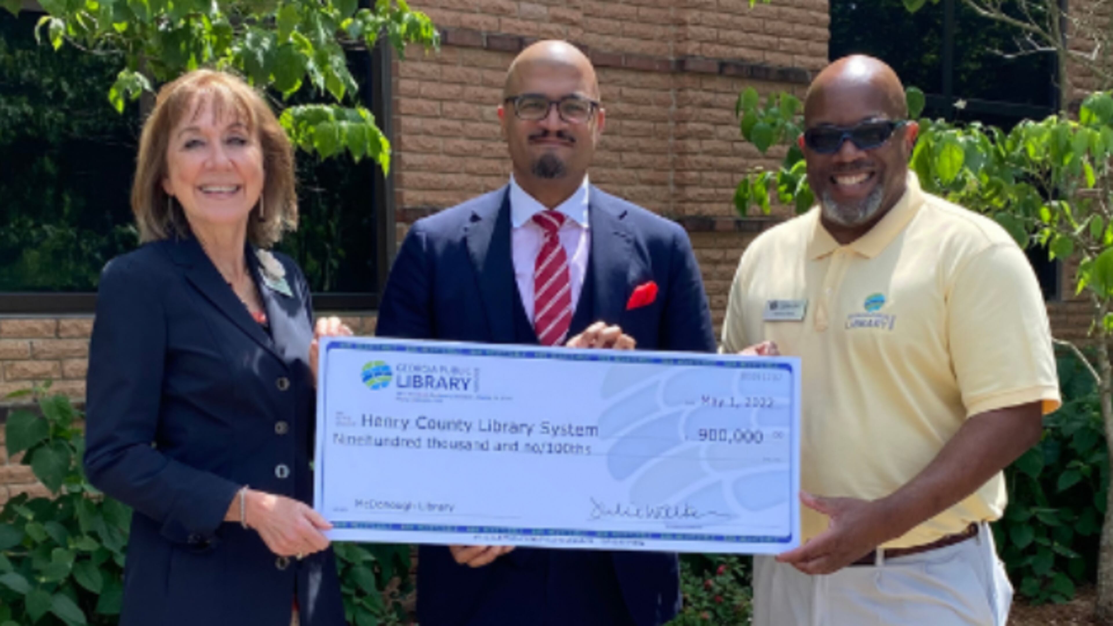 From left, state librarian Julie Walker, Henry County Library System assistant director Dr. Adam Townes, and Nathan Rall of the Georgia Public Library Service during the grant presentation earlier this year.