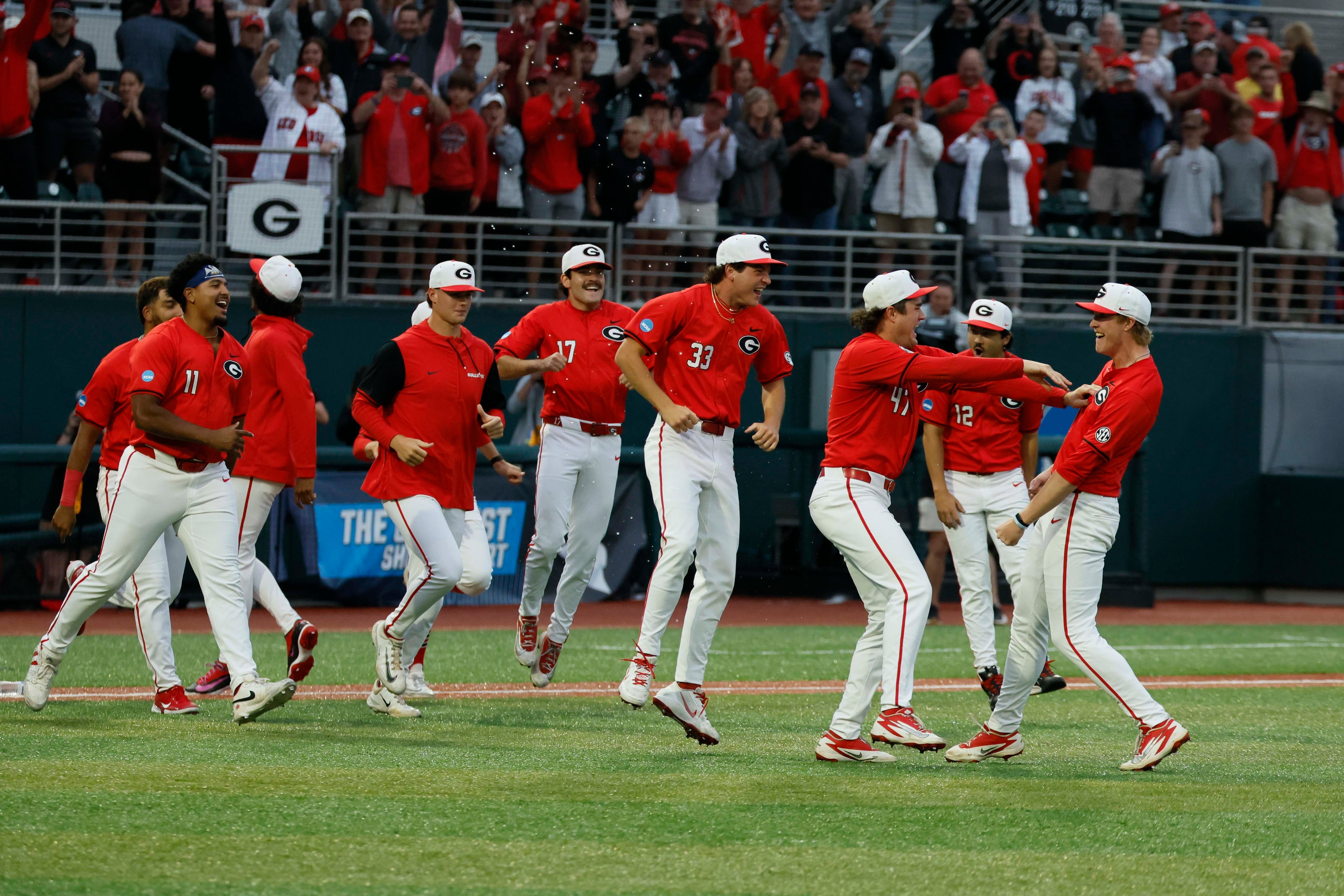 Georgia Bulldogs players rushed to celebrate with Georgia Bulldogs pitcher Zach Brown (16) after defeating the Liberty Flames 6-1 to win the NCAA Regional final at Foley Field on Sunday, May 31, 2026, in Athens.
(Miguel Martinez/AJC)