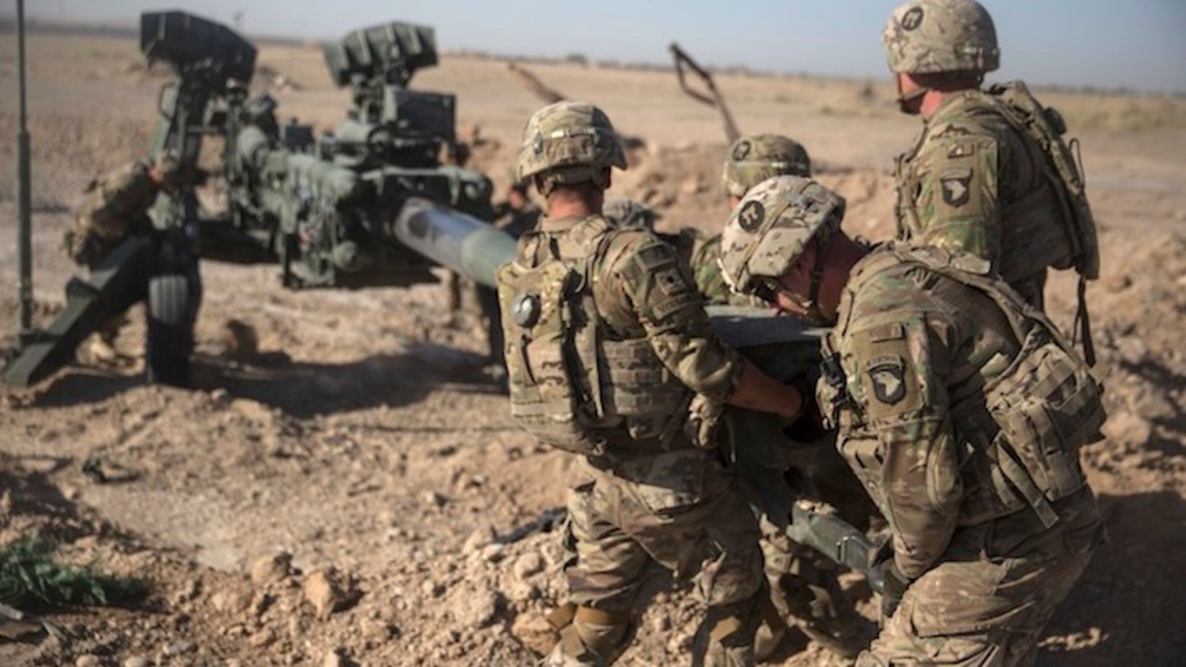 In this June 10, 2017 photo provided by Operation Resolute Support, U.S. Soldiers with Task Force Iron maneuver an M-777 howitzer, so it can be towed into position at Bost Airfield, Afghanistan. Reversing his past calls for a speedy exit, U.S. President Donald Trump recommitted the United States to the 16-year-old war in Afghanistan Monday night, Aug. 21, 2017, declaring U.S. troops must "fight to win." He pointedly declined to disclose how many more troops will be dispatched to wage America's longest war. (U.S. Marine Corps photo by Sgt. Justin T. Updegraff, Operation Resolute Support via AP, File)