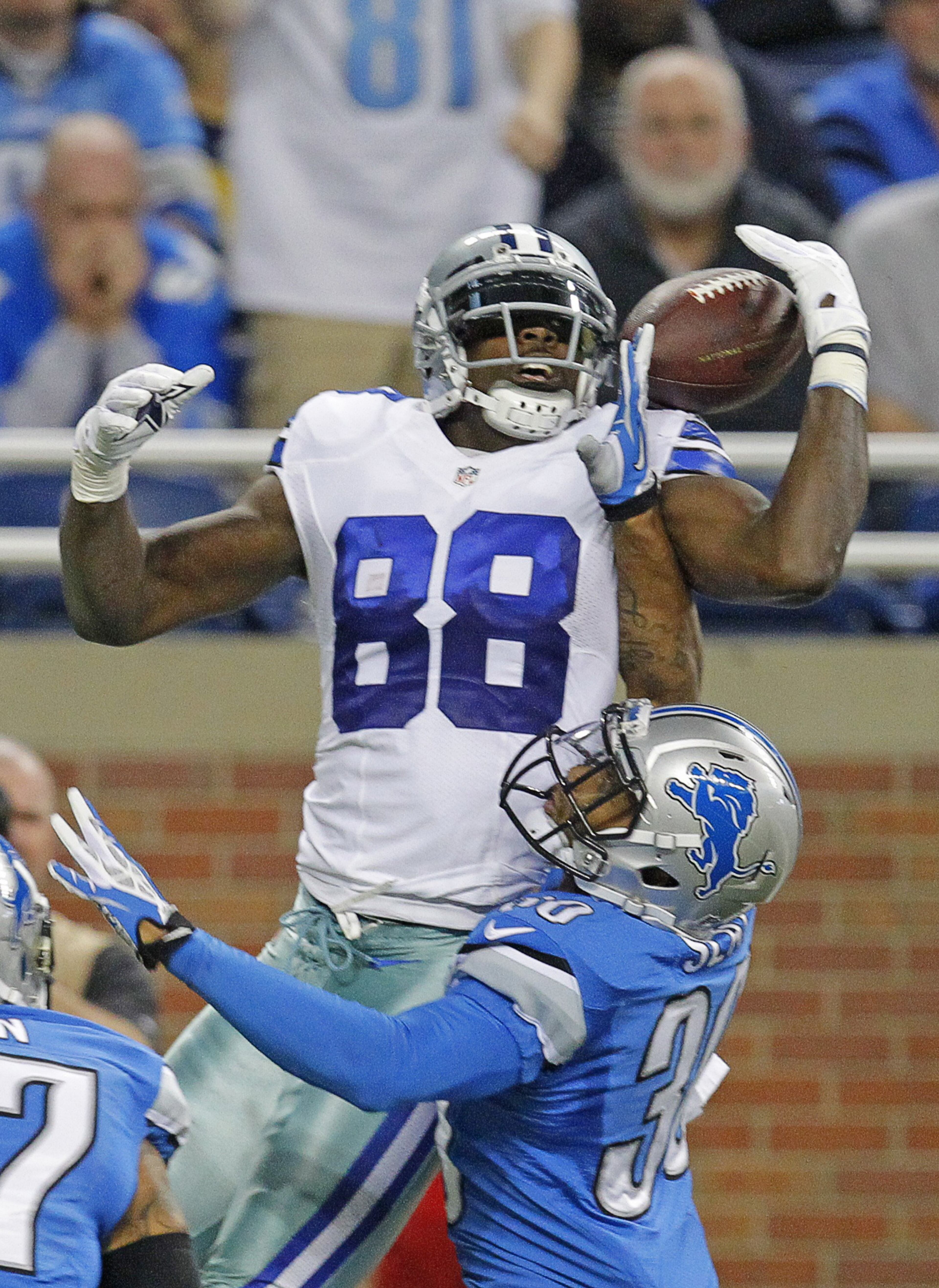 Dallas Cowboys wide receiver Dez Bryant (88) catches a touchdown pass over Detroit Lions cornerback Darius Slay (30) in the second quarter at Ford Field in Detroit. The Detroit Lions beat the Dallas Cowboys 31-30 in a classic. (Rodger Mallison/Fort Worth Star-Telegram/MCT)