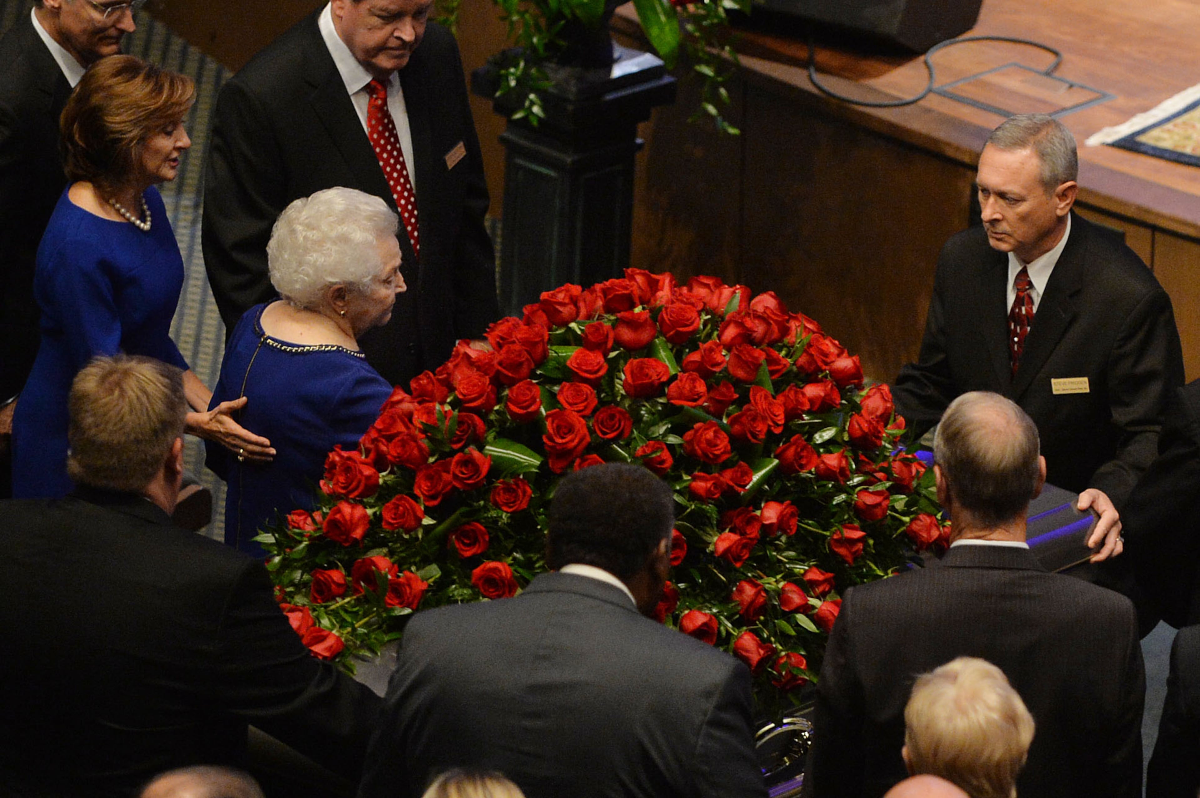 Truett Cathy's widow, Jeannette, and daughter, Trudy Cathy White, follow his casket from the church following the service for the Chick-fil-A founder at the First Baptist Church, Jonesboro, GA, Wednesday September 10, 2014.