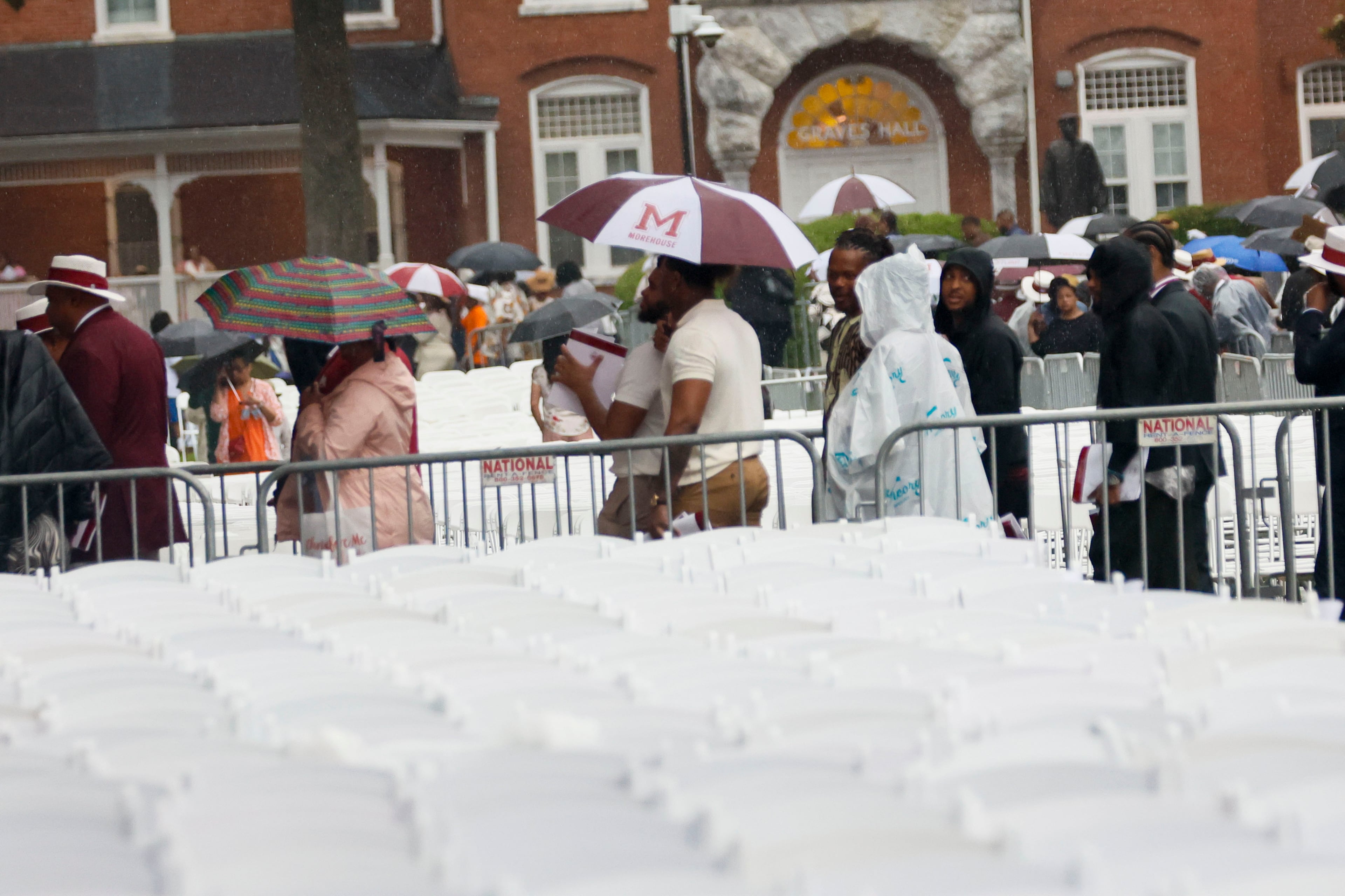 Crowds started moving out of the ceremony due to a thunderstorm in the area, and the ceremony was moved indoors at Morehouse College’s 141st Commencement Ceremony on Sunday, May 18, 2025.
(Miguel Martinez/ AJC)