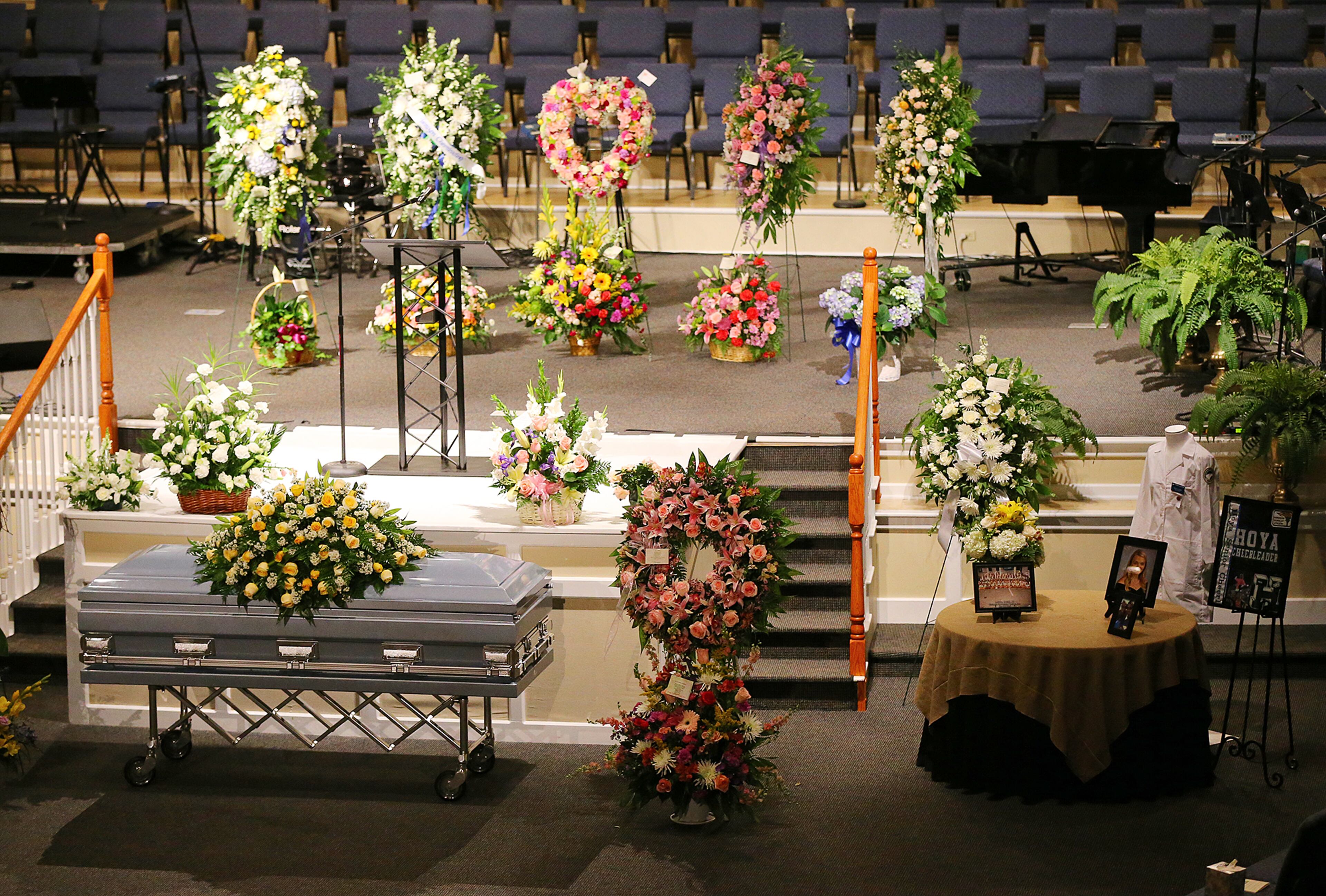 Flowers fill the sanctuary for a service of praise and celebration for the life of Emily Elizabeth Clark at Burnt Hickory Baptist Church on Sunday, April 26, 2015, in Powder Springs. Clark and four other nursing students from Georgia Southern University were killed in a multi-vehicle accident while fulfilling course work in their nursing program last week. Curtis Compton / ccompton@ajc.com