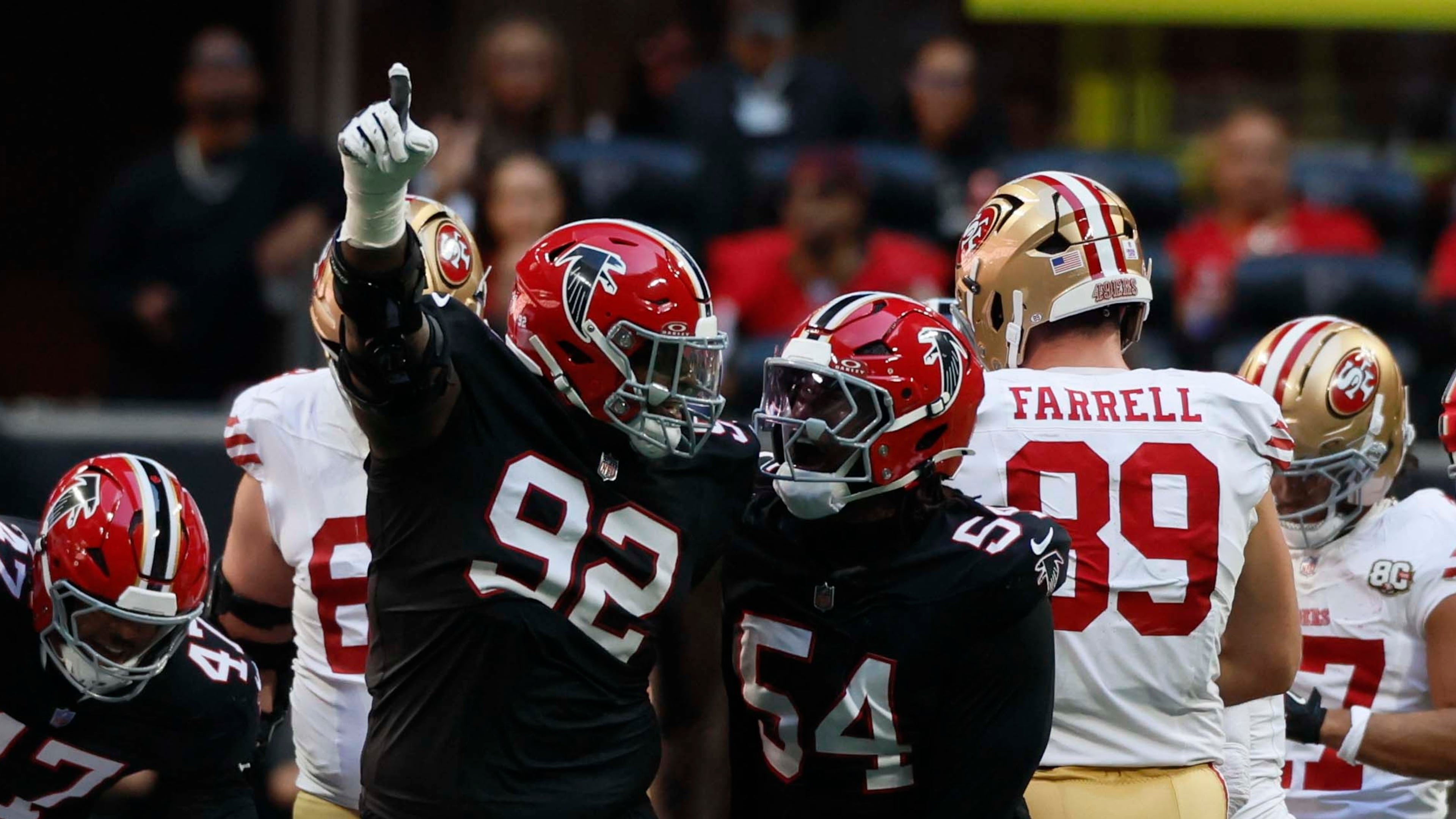 Falcons defensive tackle Maason Smith (left) and defensive end Brandon Dorlus celebrate after recovering a fumble Sunday, Oct. 25, 2026, against the 49ers at Mercedes-Benz Stadium in Atlanta. (Miguel Martinez/AJC)