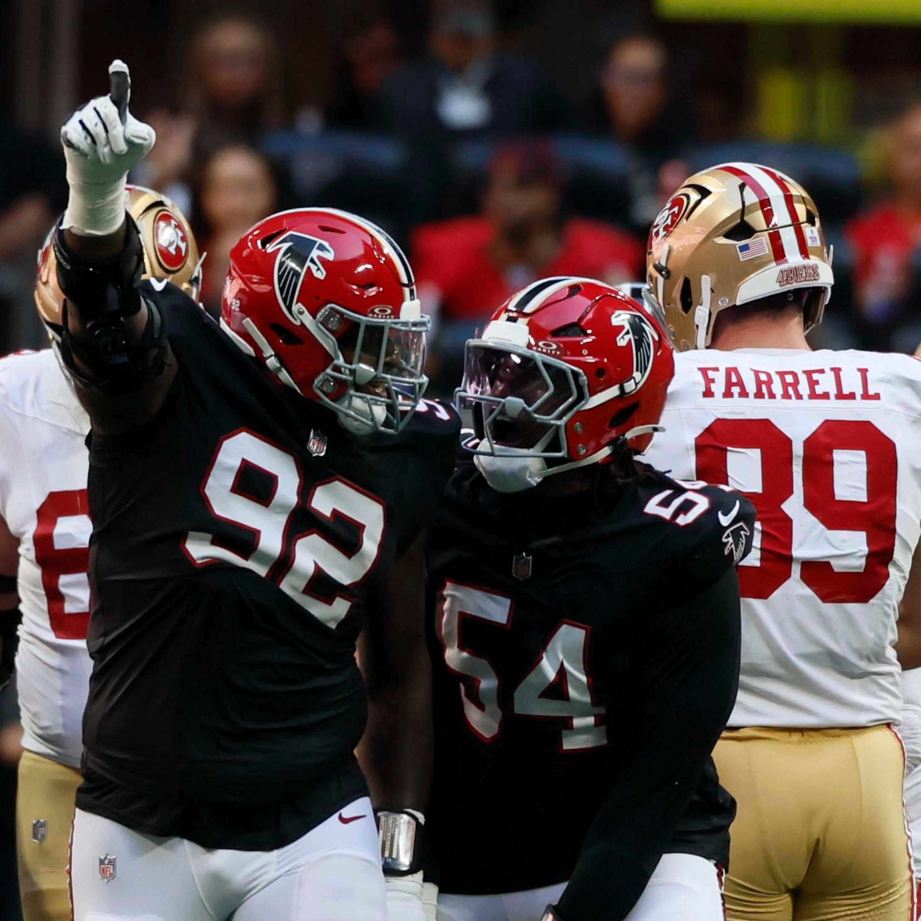 Falcons defensive tackle Maason Smith (left) and defensive end Brandon Dorlus celebrate after recovering a fumble Sunday, Oct. 25, 2026, against the 49ers at Mercedes-Benz Stadium in Atlanta. (Miguel Martinez/AJC)