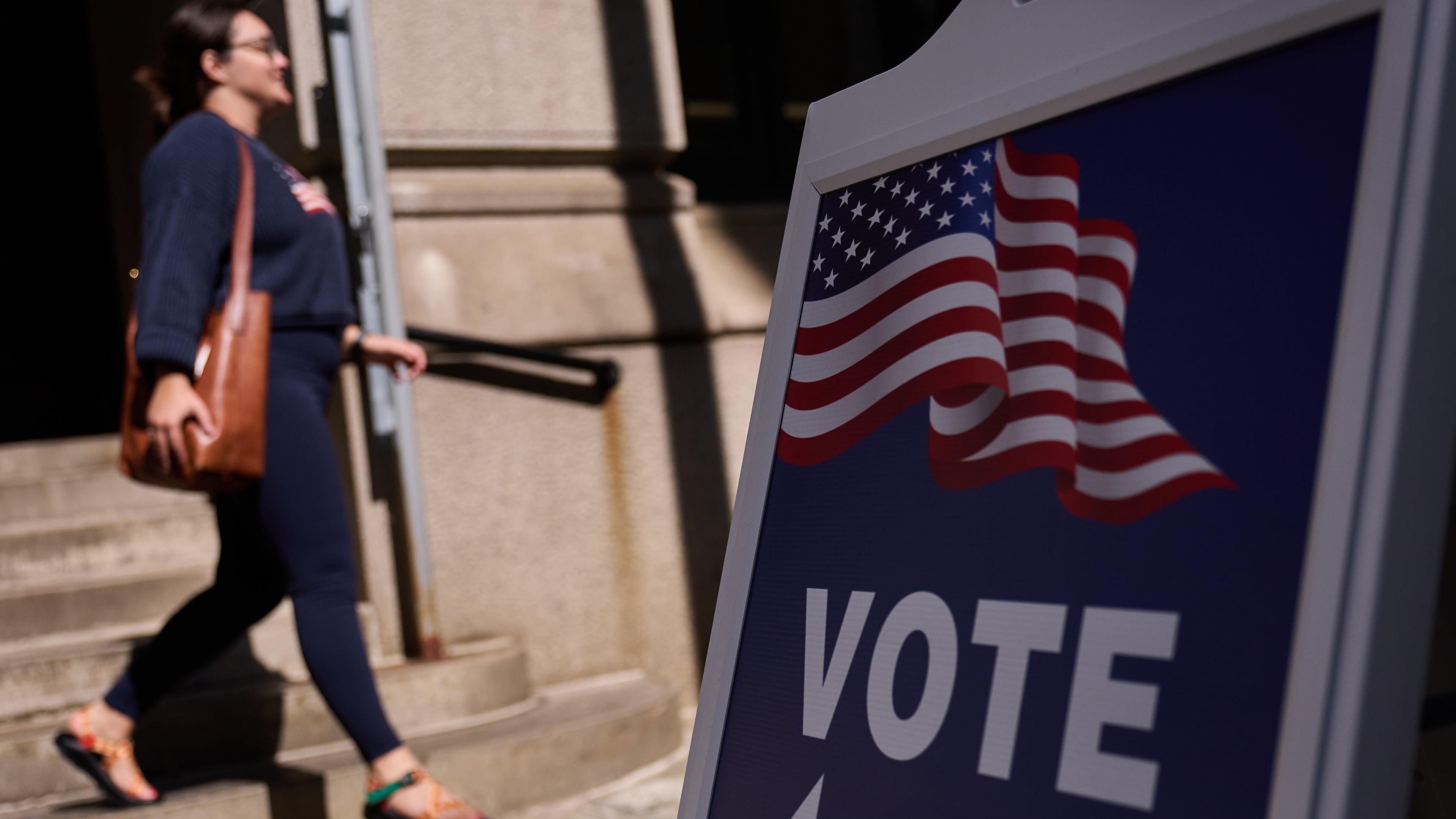 A sign directs voters to an entrance for City Hall during early voting for the Rhode Island primary election, Wednesday, Sept. 2, 2026, in Providence, R.I. (AP Photo/David Goldman)