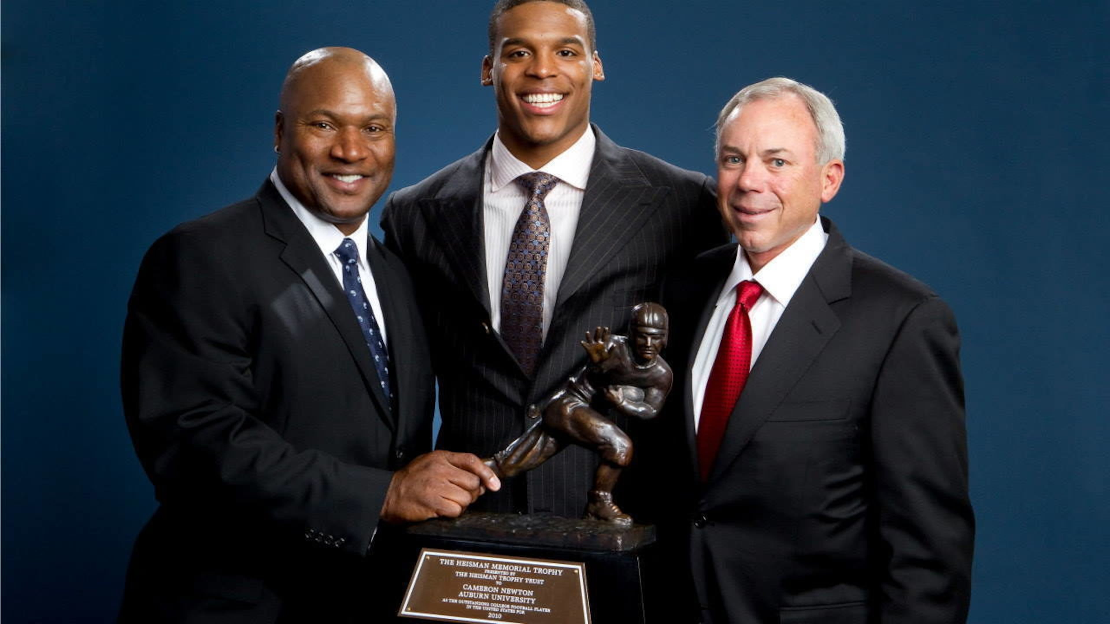 Pat Sullivan, right, was the first Auburn player to win the Heisman Trophy. He was followed by Bo Jackson, left, and Cam Newton.