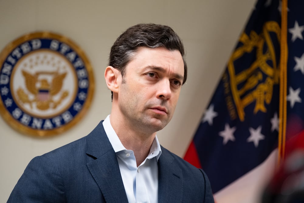 U.S. Sen. Jon Ossoff speaks to reporters before the start of Georgia Service Academy Day at Dobbins Air Reserve Base in Marietta in March. (Ben Gray for the AJC)