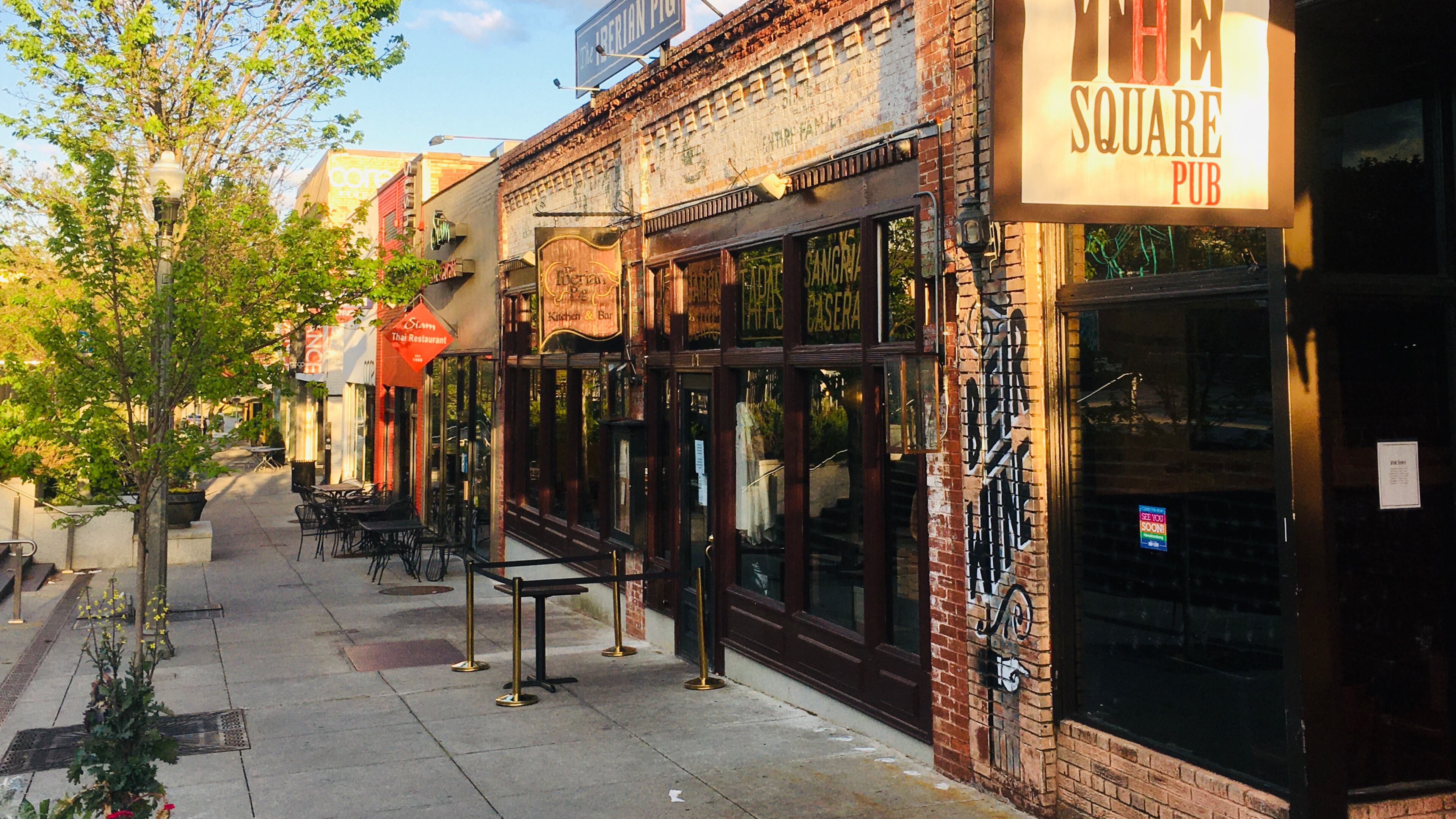 This sidewalk on the Decatur Square is usually packed with patrons during a normal weeknight, but the area’s turned into a virtual ghost town during the COVID-19 outbreak. The Square Pub (foreground), beloved by many, has closed for good, but that came shortly before the virus. Bill Banks for the AJC