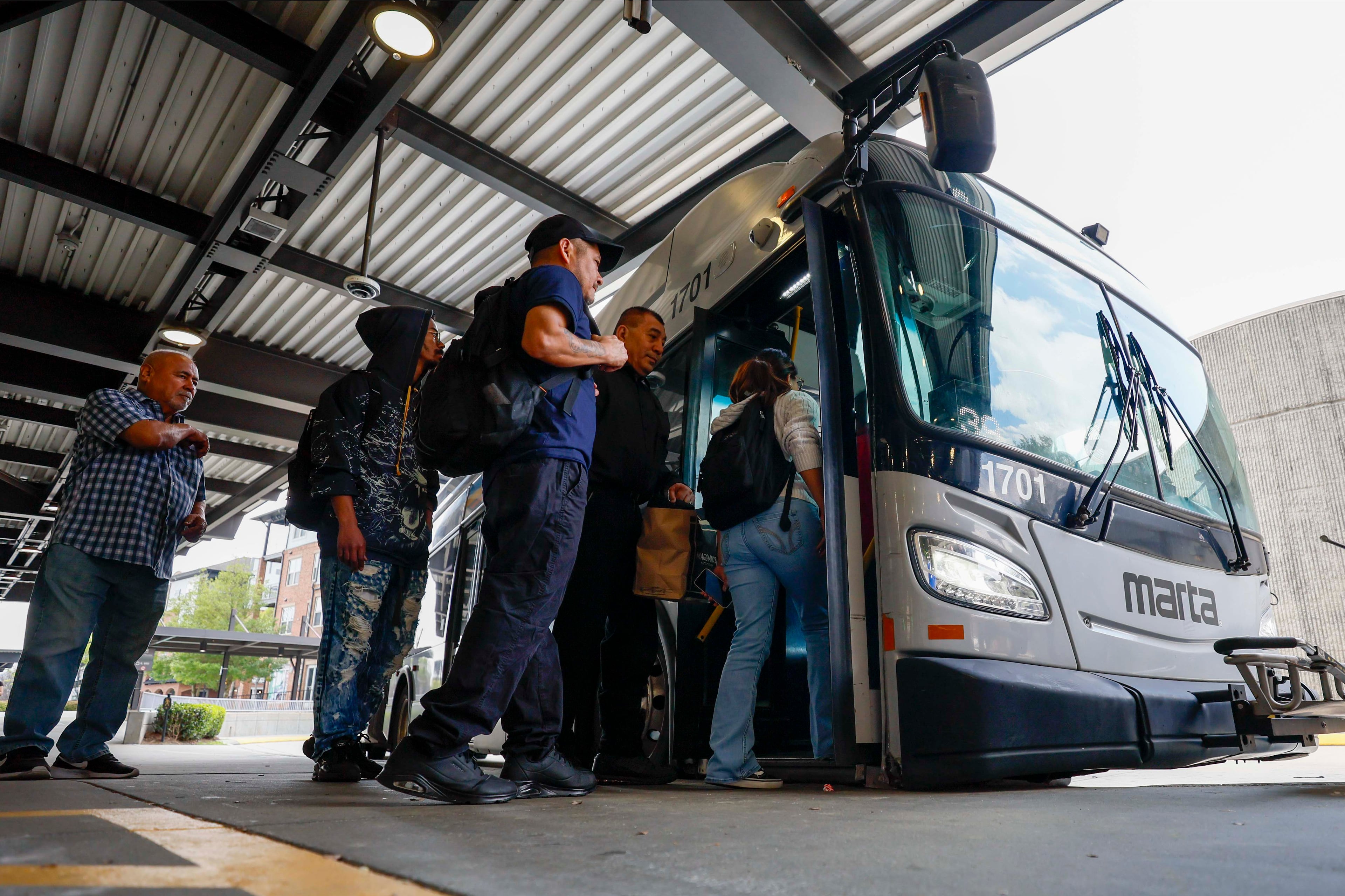 MARTA riders are seen getting on bus route 39 at the Lindbergh Center Station bus loop on Thursday, March 26, 2026. Every route in the system has been changed as part of a bus network redesign that's meant to bring more frequent and reliable service to more people. The new routes, which begin April 18, will cover less distance geographically but will run more frequently. (Miguel Martinez/AJC)