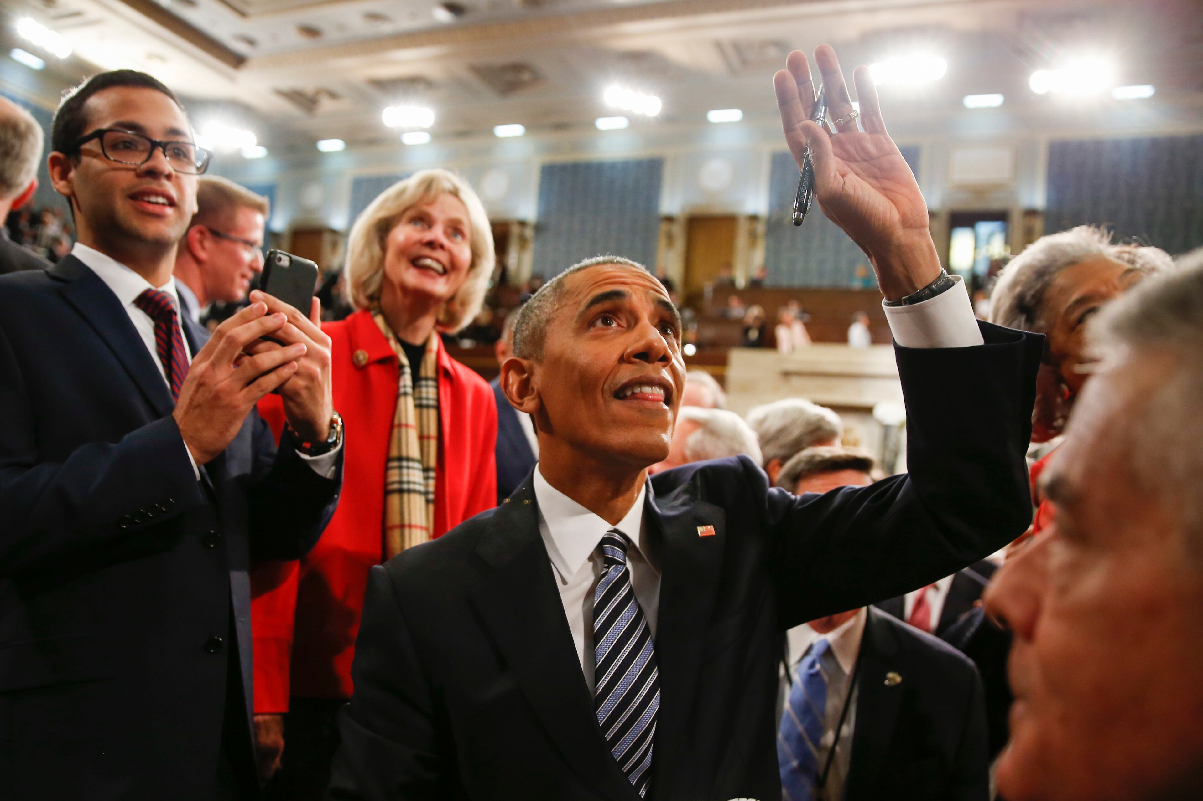 President Barack Obama waves as he walks back up the aisle at conclusion of his State of the Union address to a joint session of Congress on Capitol Hill in Washington, Tuesday, Jan. 12, 2016. (AP Photo/Evan Vucci, Pool)