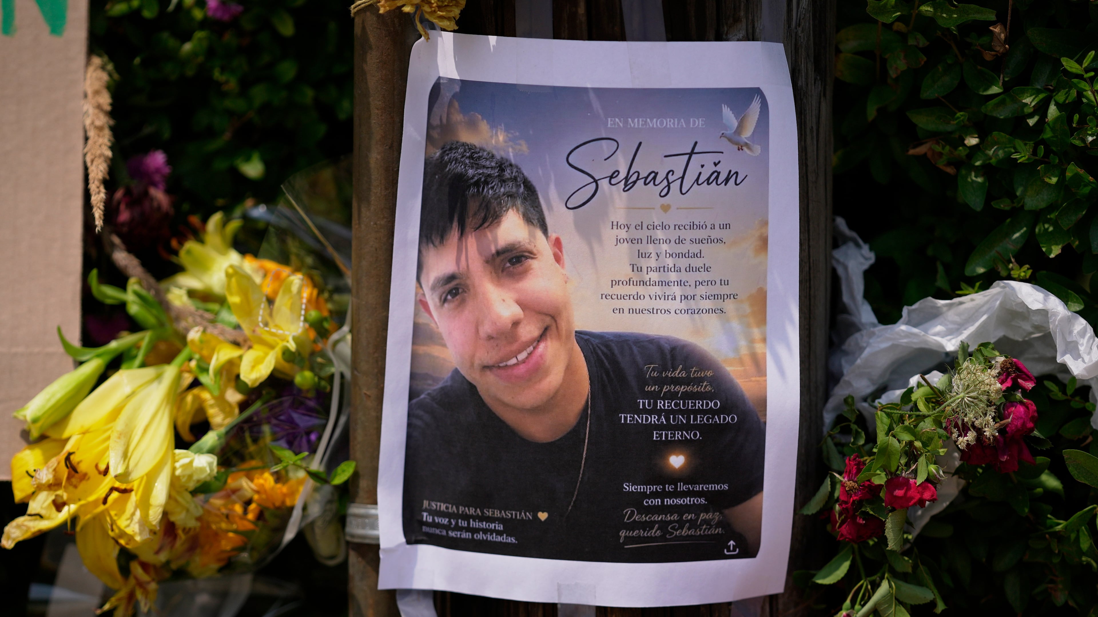 FILE - A poster of Johan Sebastián Durán Guerrero, a man killed by U.S. Immigration and Customs Enforcement, is displayed among flowers and tributes at a makeshift memorial in Biddeford, Maine, July 15, 2026. (AP Photo/Robert F. Bukaty, File)