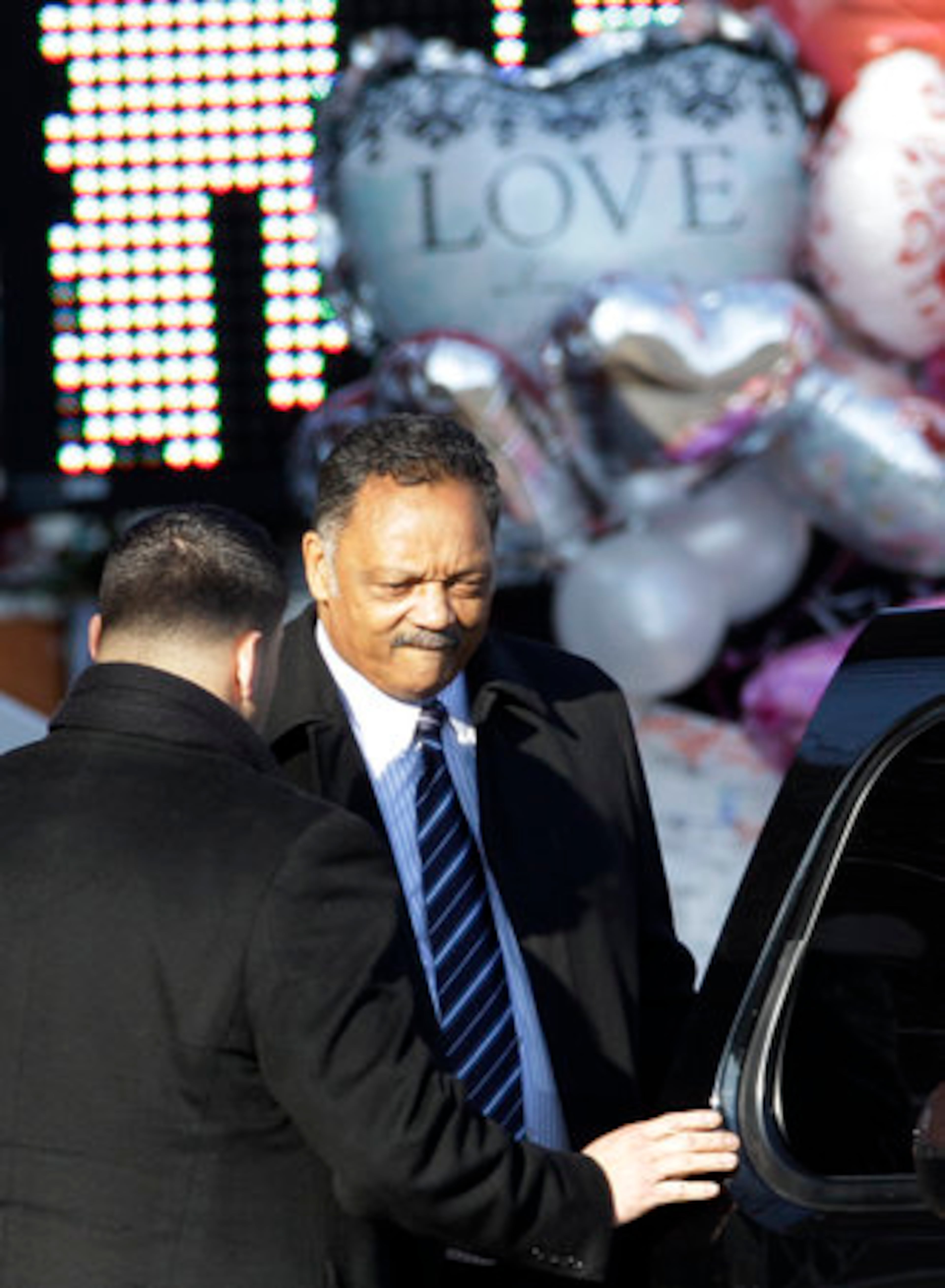Rev. Jesse Jackson returns to his car after visiting the New Hope Baptist Church in Newark, N.J., Saturday, Feb. 18, 2012. Funeral services for singer Whitney Houston will be held at the church later in the day.