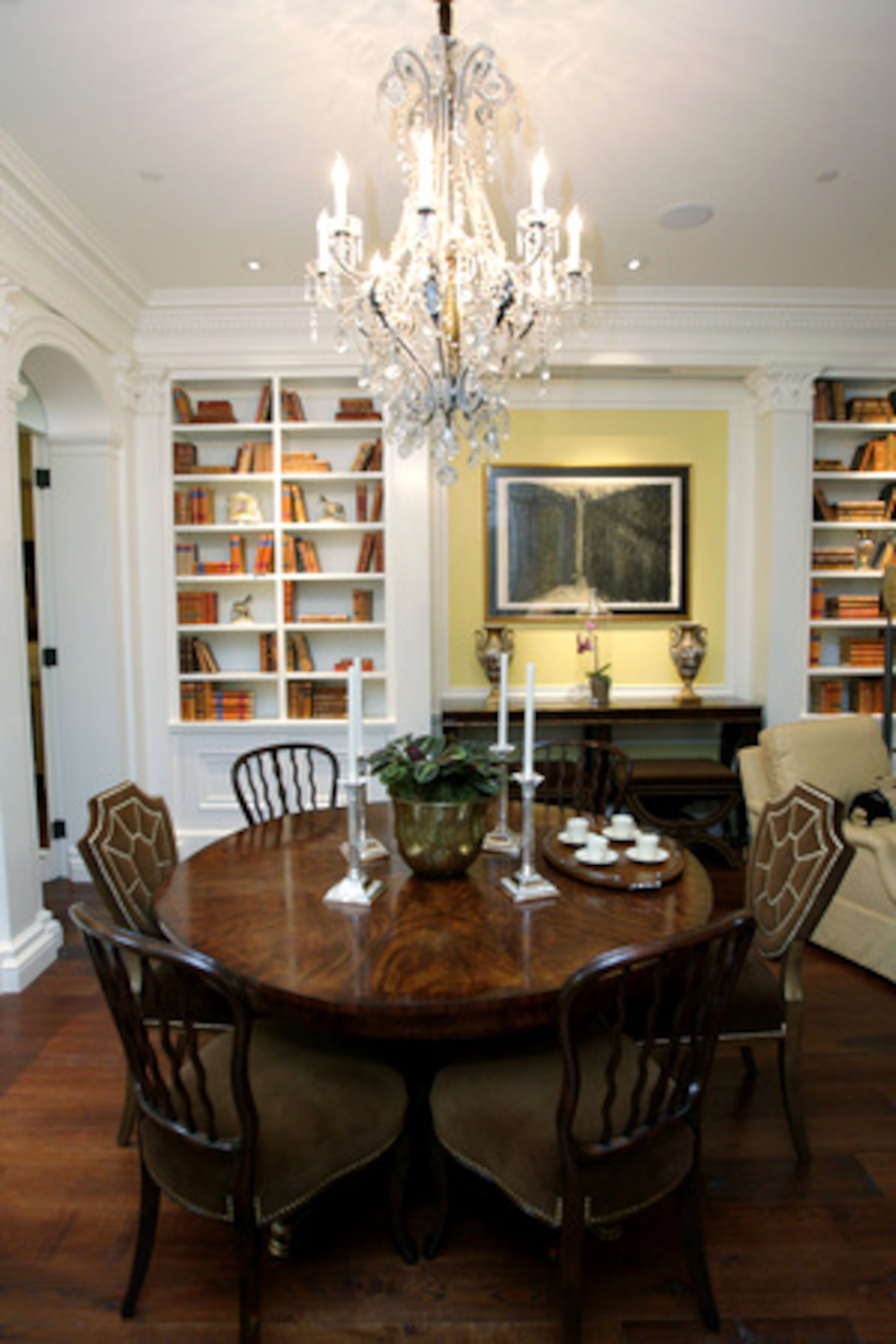 The dining table, by Althorp, doubles as a library table.