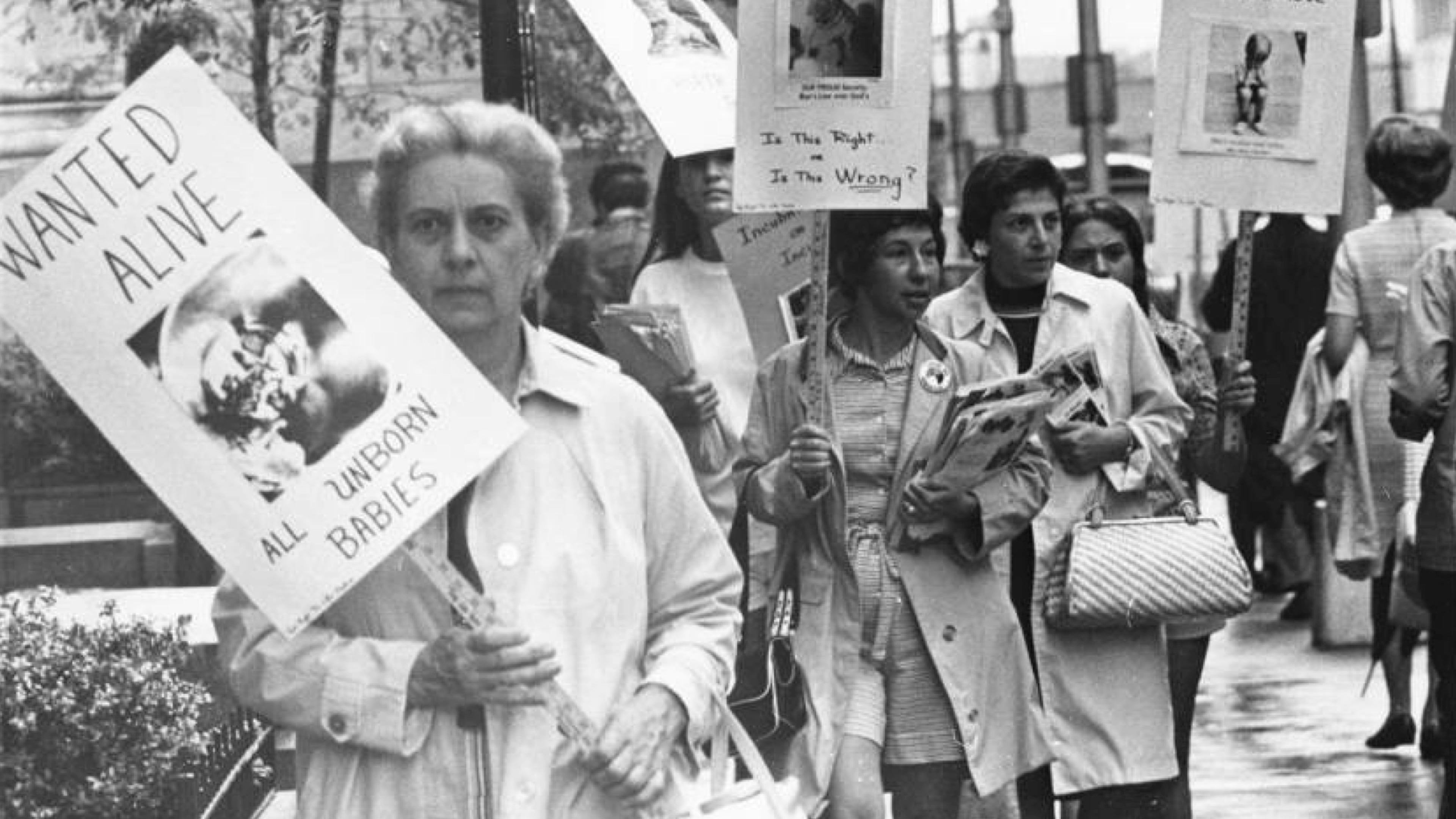 Anti-abortion protestors picket along a sidewalk in downtown Atlanta in 1971. That year, there were 1,580 recorded legal abortions in Georgia, as allowed by the state's 1968 abortion law. (Charles Pugh / AJC archive at GSU Library AJCP178-009i)