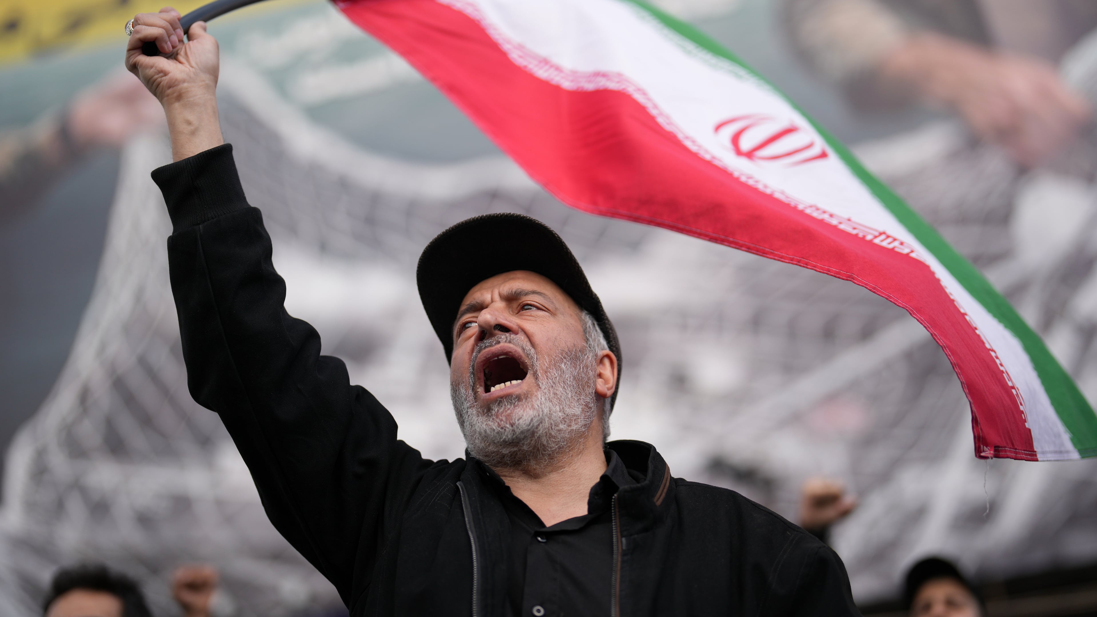 A government supporter chants slogans during a gathering after the announcement of a two-week ceasefire with the United States and Israel in Tehran, Iran, Wednesday, April 8, 2026. (AP Photo/Francisco Seco)