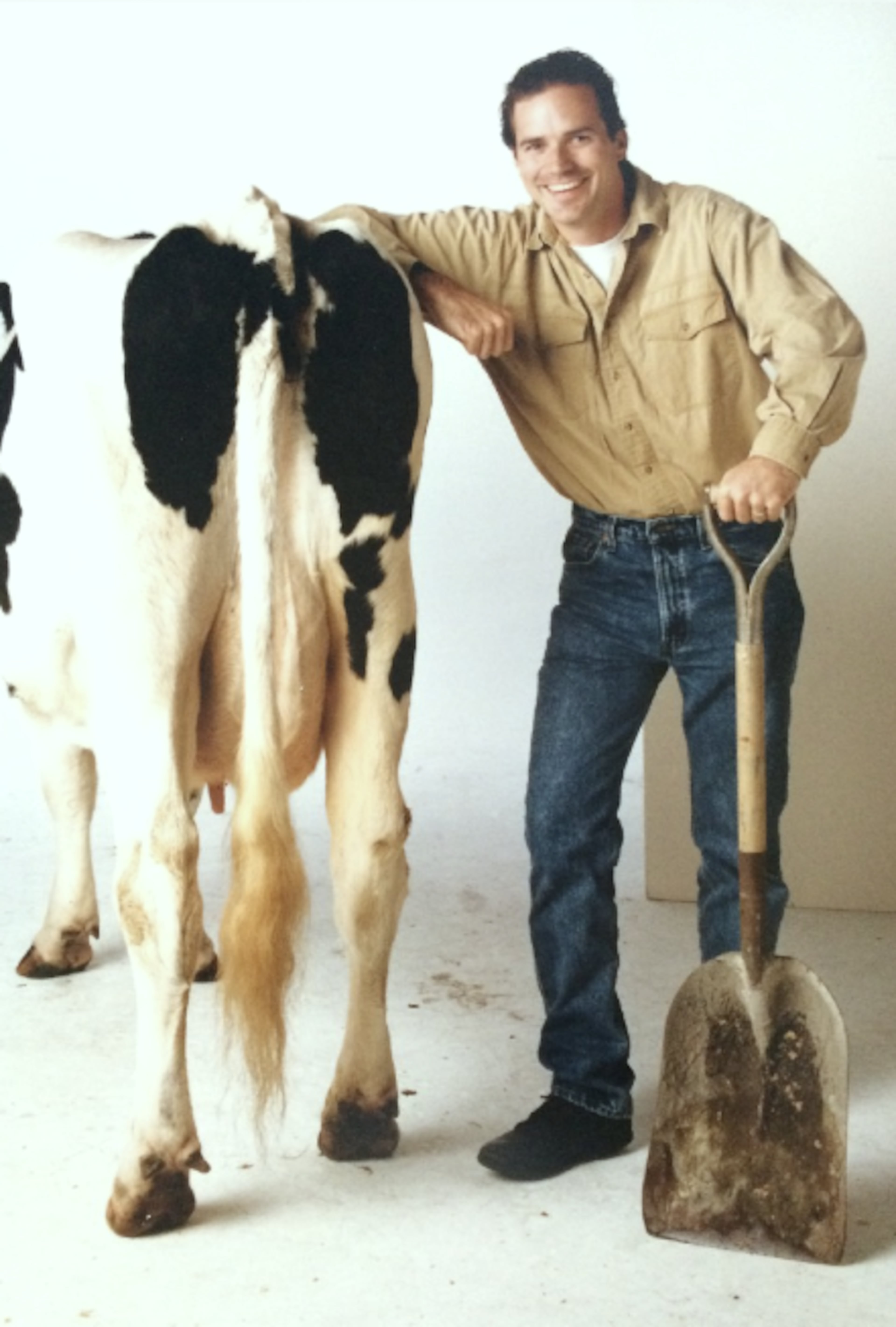 David Ring, the creative mind behind Chick-fil-A's iconic cow marketing campaign, poses with one of the Chick-fil-A cows during a photoshoot in 1995. (Courtesy of David Ring)