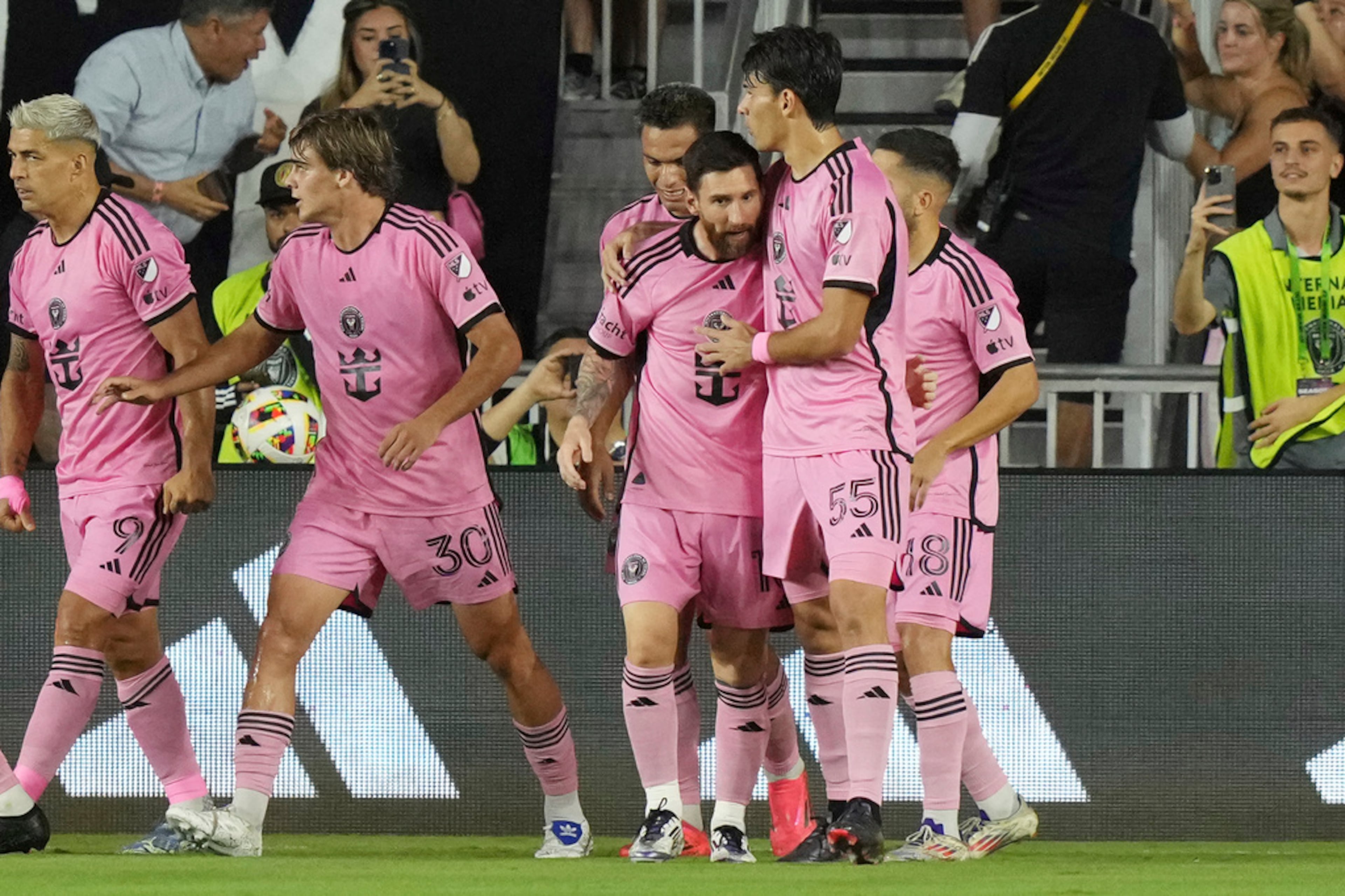 Inter Miami teammates congratulate forward Lionel Messi (10) after he scored a goal during the first half of their MLS playoff opening round soccer match against the Atlanta United, Saturday, Nov. 9, 2024, in Fort Lauderdale, Fla. (AP Photo/Lynne Sladky)