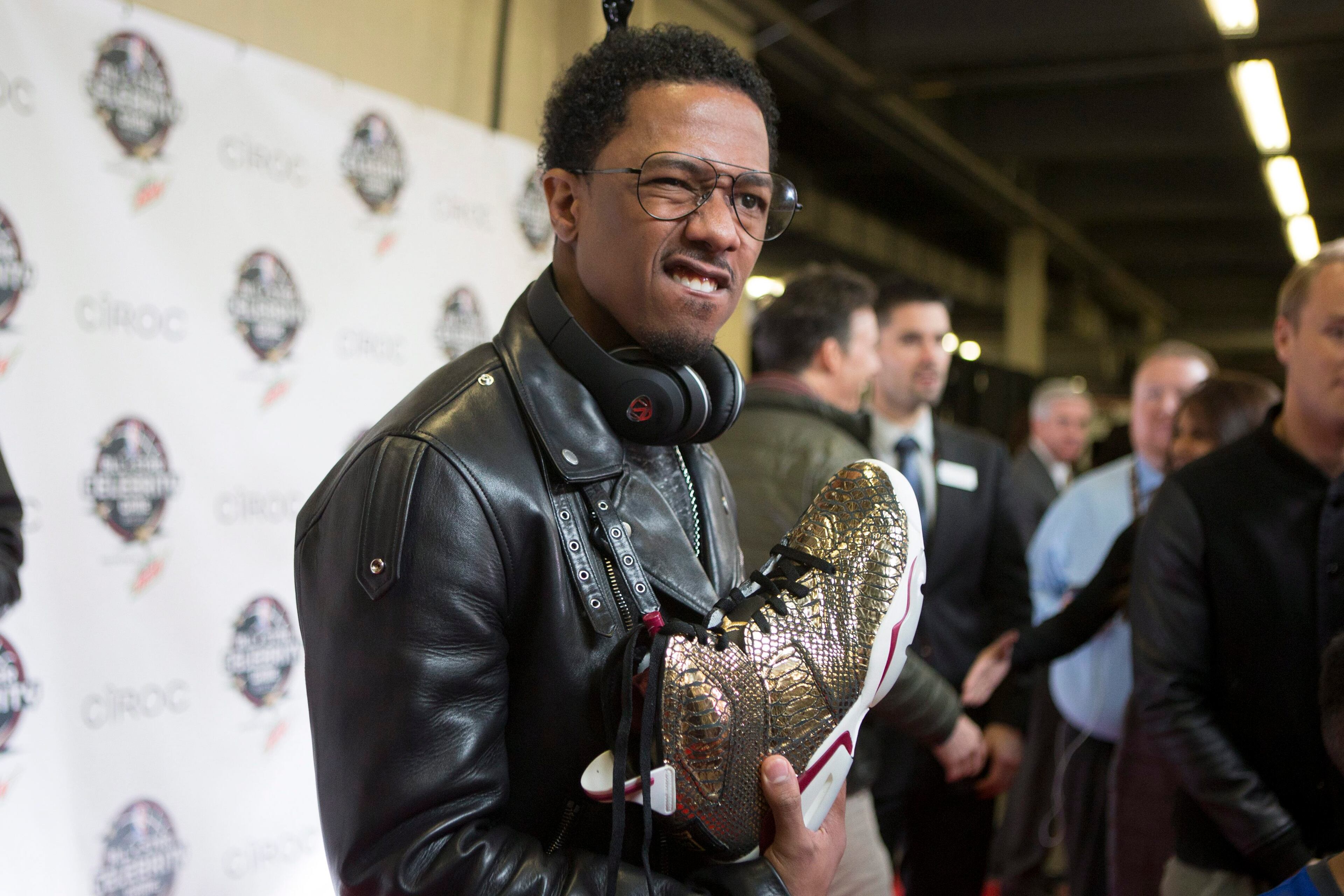 Actor comedian Nick Cannon arrives for the Celebrity Game, part of NBA basketball's All-Star weekend, in Toronto on Friday, Feb. 12, 2016. (Chris Young/The Canadian Press via AP)