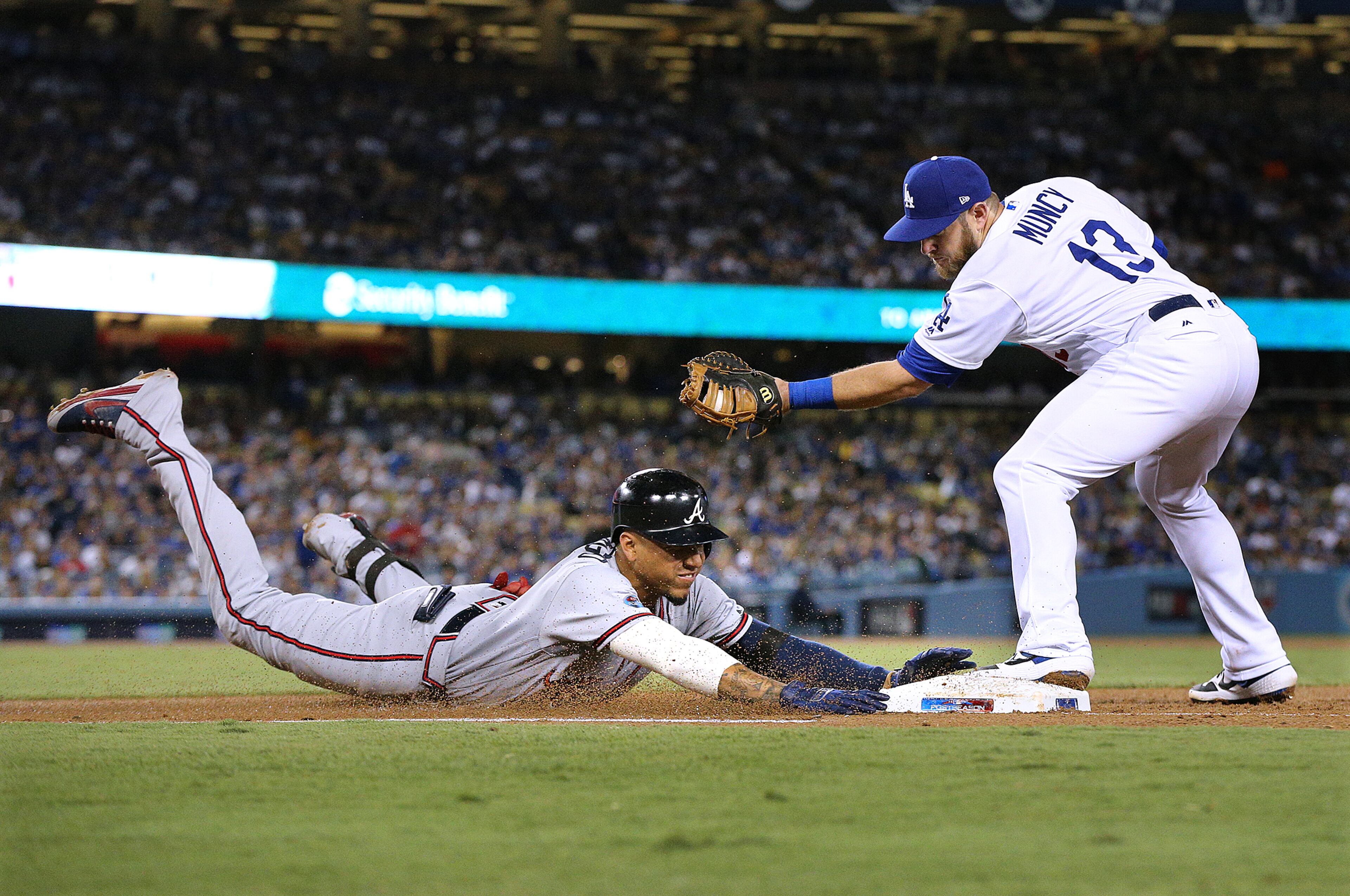October 5, 2018 Los Angeles: Atlanta Braves batter Johan Camargo is out at first base by Los Angeles Dodgers Max Muncy on a ground ball to Clayton Kershaw during the 4th inning in Game 2 of a National League Division Series baseball game on Friday, Oct 5, 2018, in Los Angeles. Curtis Compton/ccompton@ajc.com