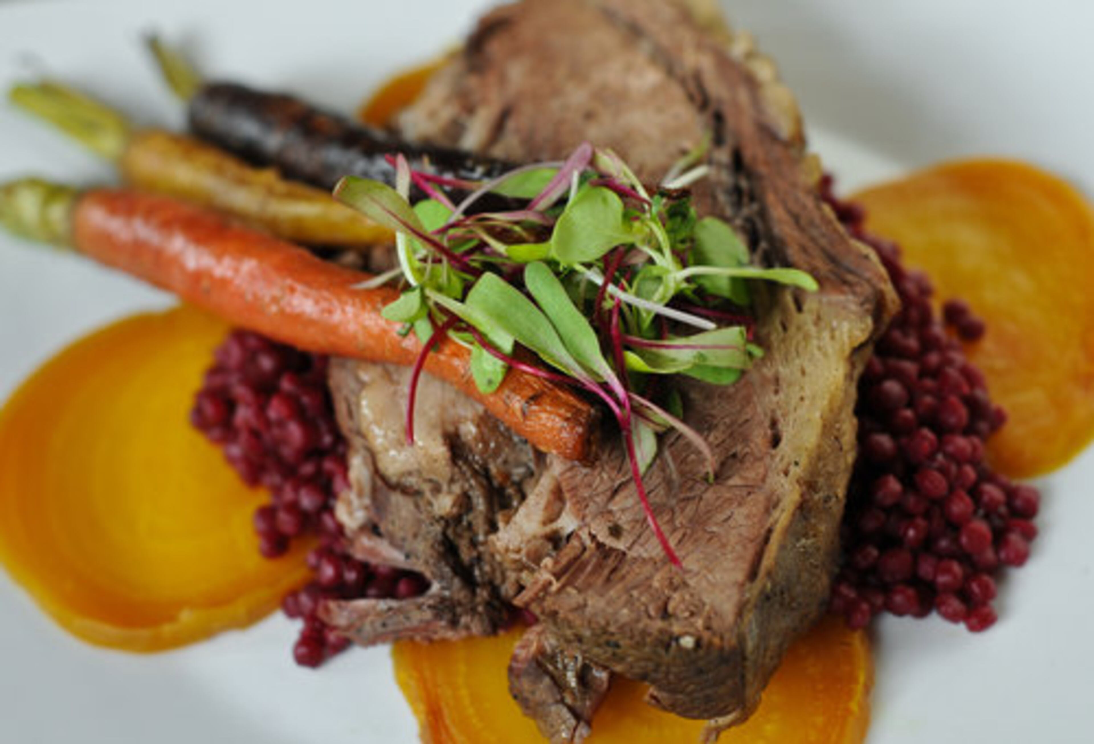 The King Platter -- brisket with natural jus, roasted root vegetables and couscous -- at Ten Bistro in Norcross. Jenny Turknett writes, "The kitchen seems to have a fittingly laid-back approach, resulting in a few missteps along the way...perhaps after a little more time for exploration, they can work it out." One star.