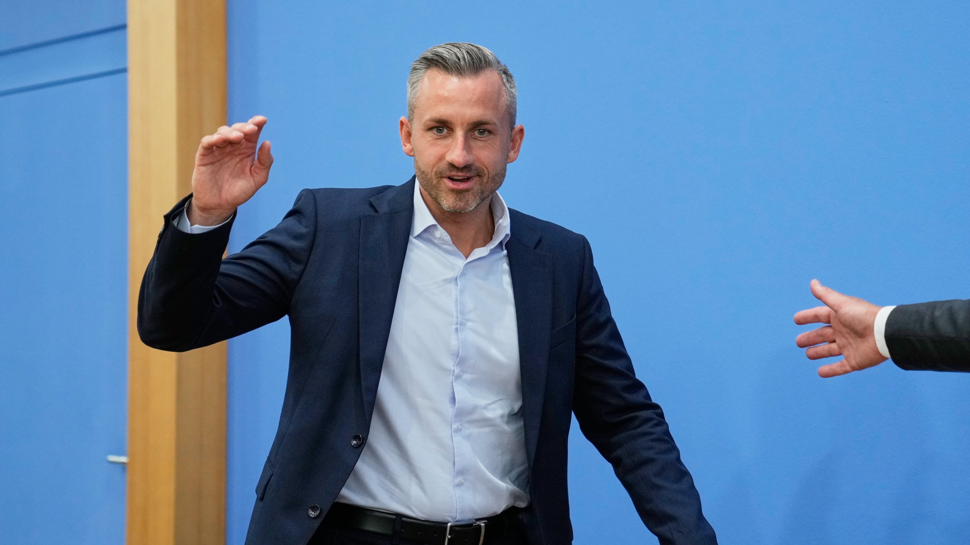 Top candidate for the Saxony-Anhalt state elections Ulrich Siegmund, center, attends a press conference in Berlin, Germany, Monday, Sept. 7, 2026. (AP Photo/Ebrahim Noroozi)