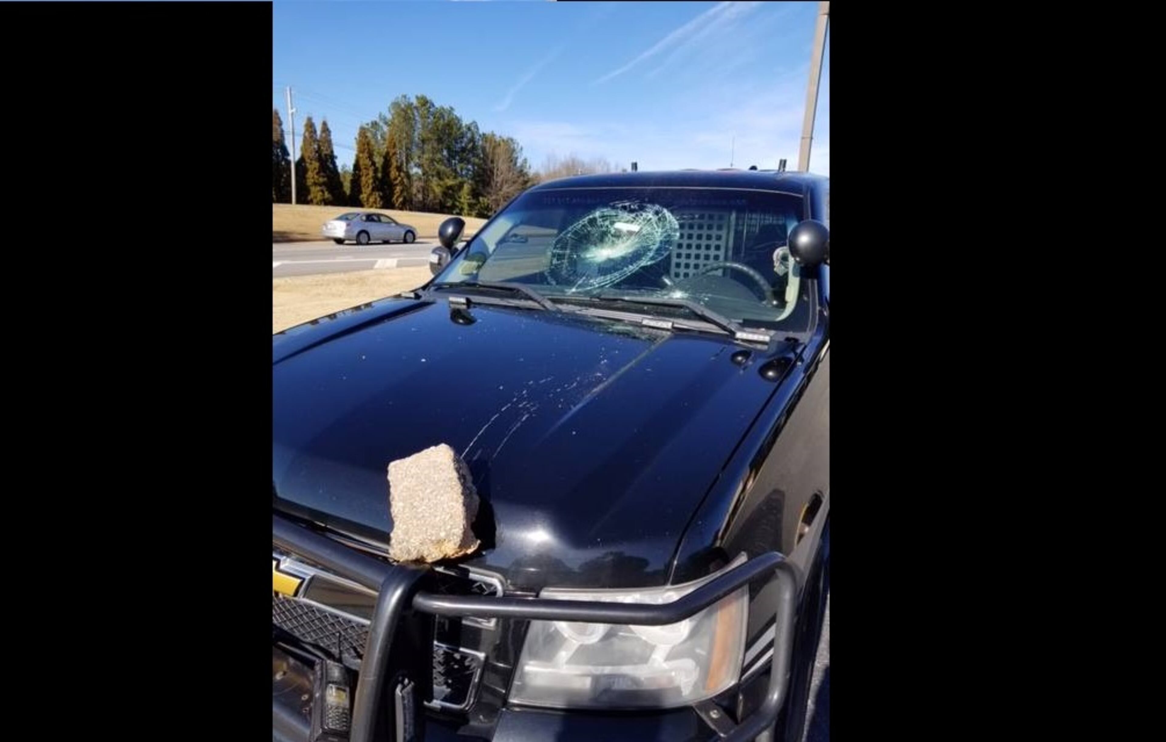A man threw a brick into the windshield of a Gwinnett County Sheriff's Office patrol car.