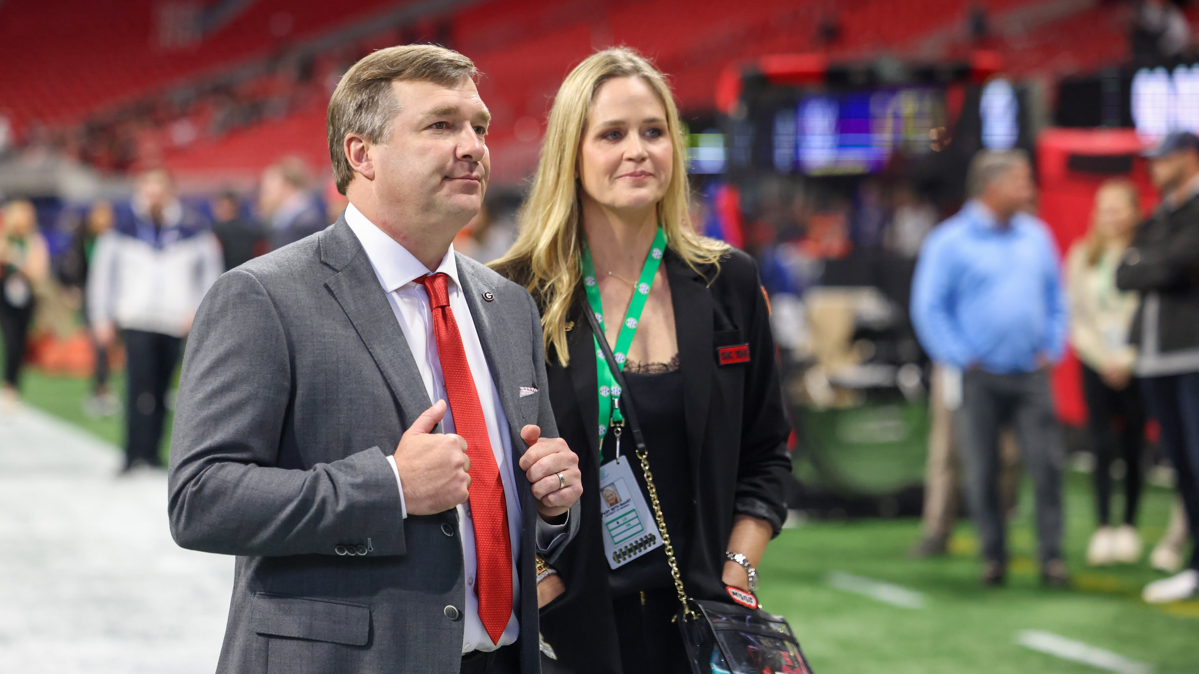Georgia Bulldogs coach Kirby Smart enters Mercedes-Benz Stadium with his wife, Mary Beth Smart, for SEC Championship game against the LSU Tigers on Saturday, Dec. 3, 2022. (Jason Getz / Jason.Getz@ajc.com)