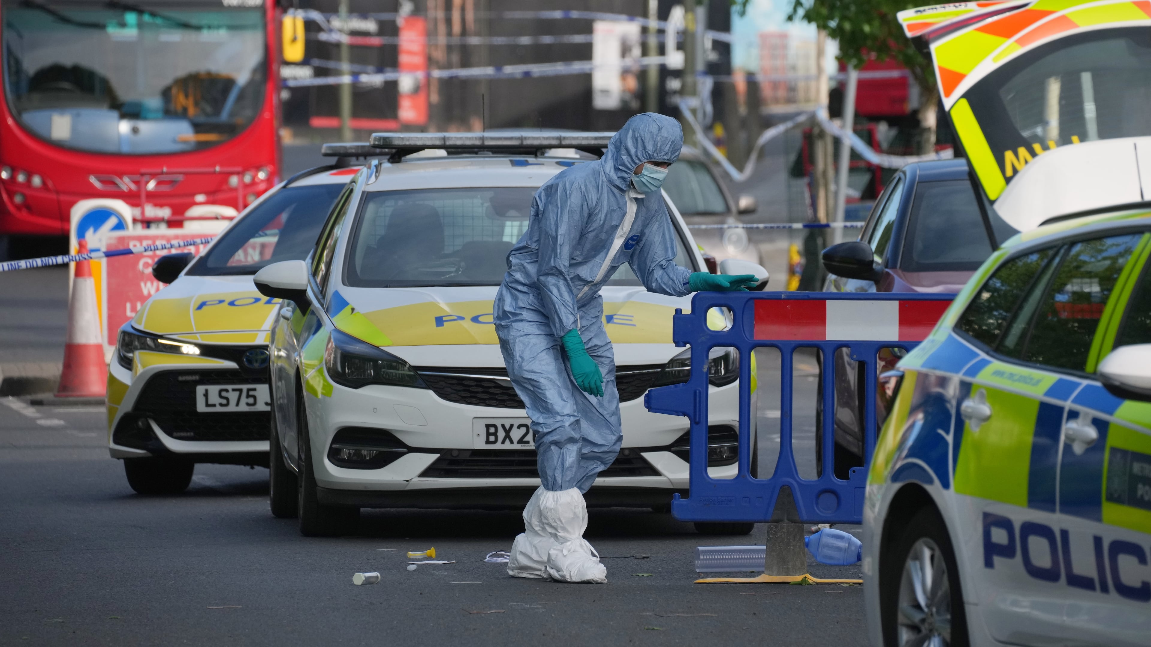 Forensic officers search the area after two people were stabbed in Golders Green neighborhood, that has a large Jewish community, in London, Wednesday, April 29, 2026.(AP Photo/Kin Cheung)