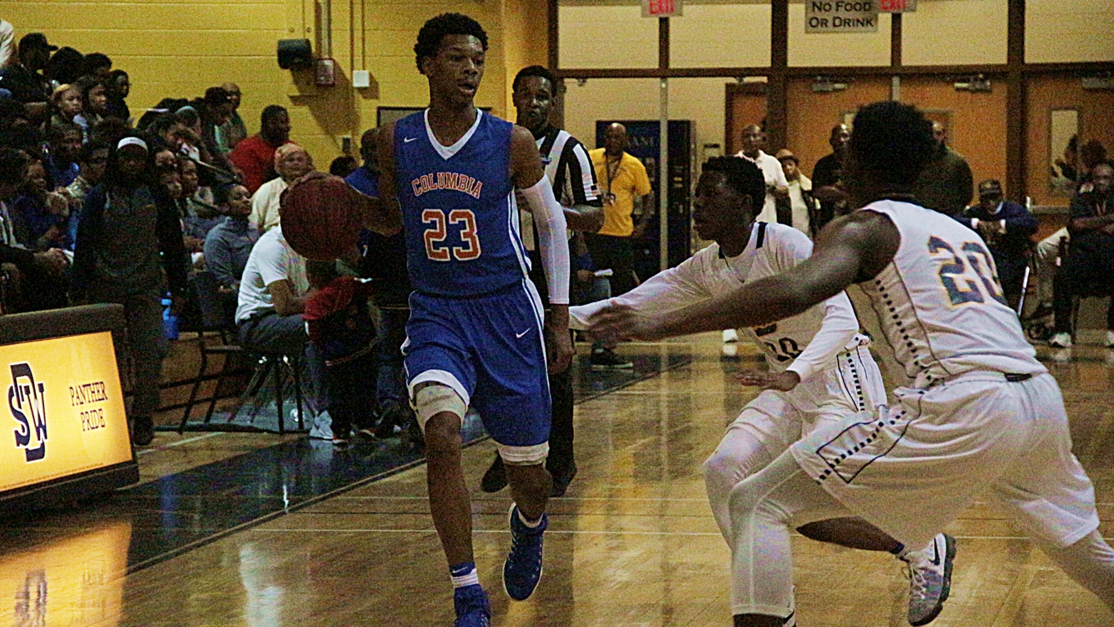 Columbia's Terrance Boykin mixes it up with SWD's Joshua Archer. (Photo - Mark Brock)