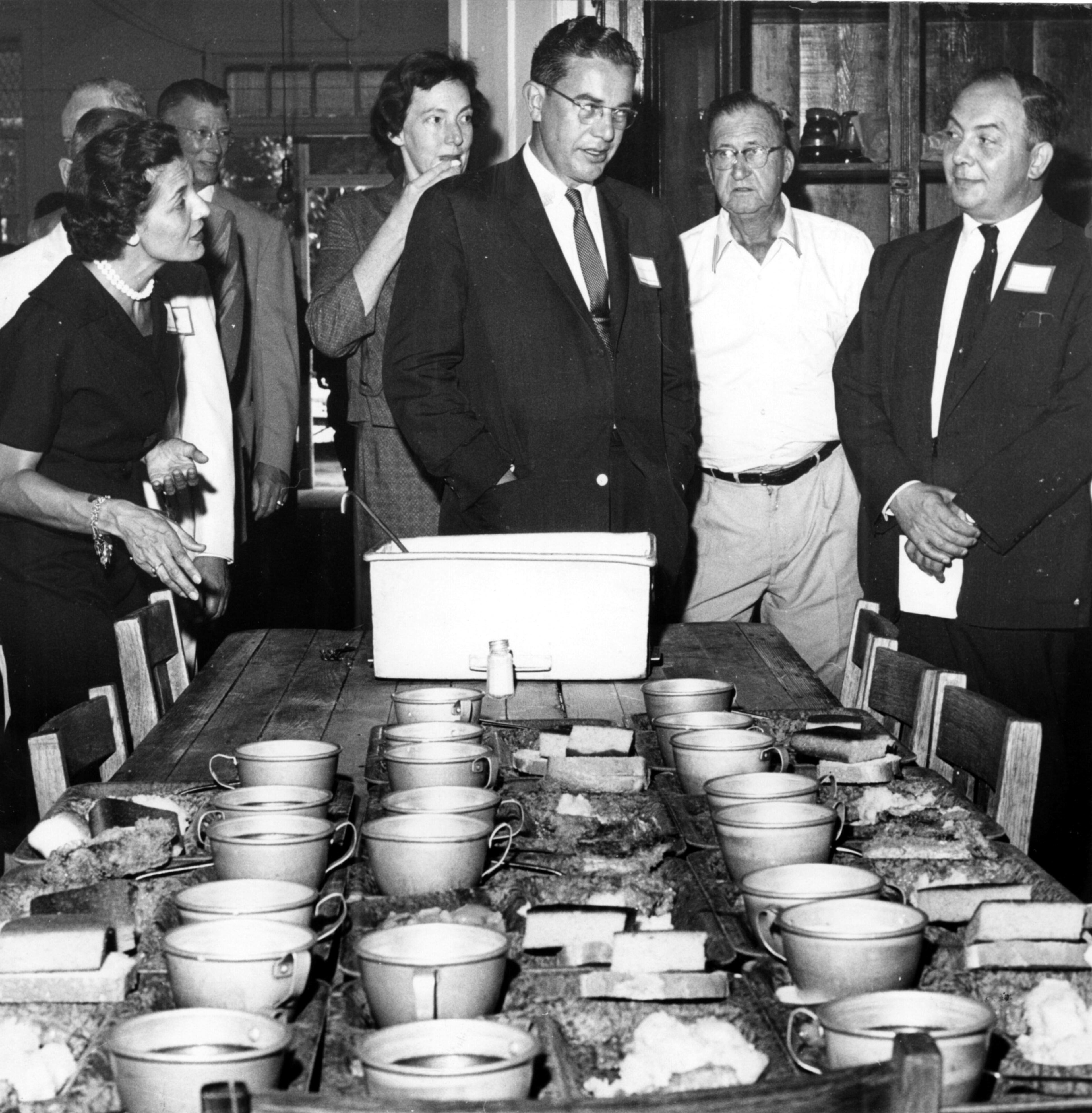 Gov. and Mrs. Ernest Vandiver inspect Milledgeville food. Other (l-r), Rep. Culver Kidd, reporter Celestine Sibley, staff member Dr. Rottersman. (Staff photo-Jerry Huff) 1959