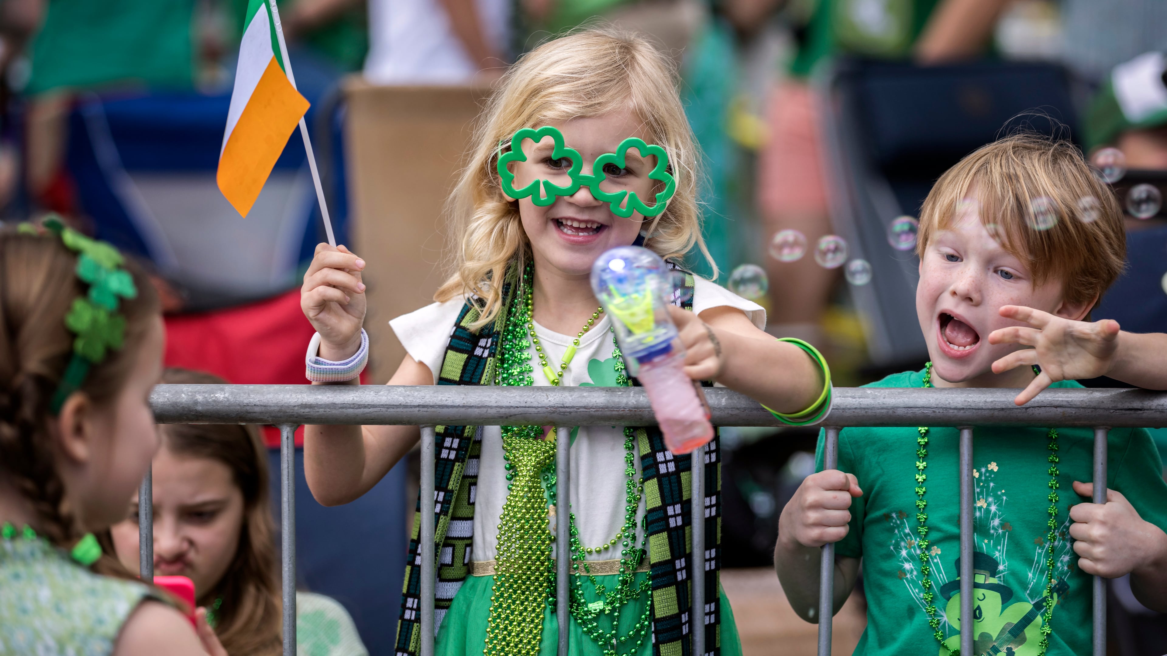 SAVANNAH, GA - MARCH 16, 2024: Six-year-old Eloise Tallon of Savannah waves to friends during the St. Patrick's Day parade, Saturday, March 16, 2024, in Savannah, Ga. This is the 200th parade since the first in 1824. (AJC Photo/Stephen B. Morton)