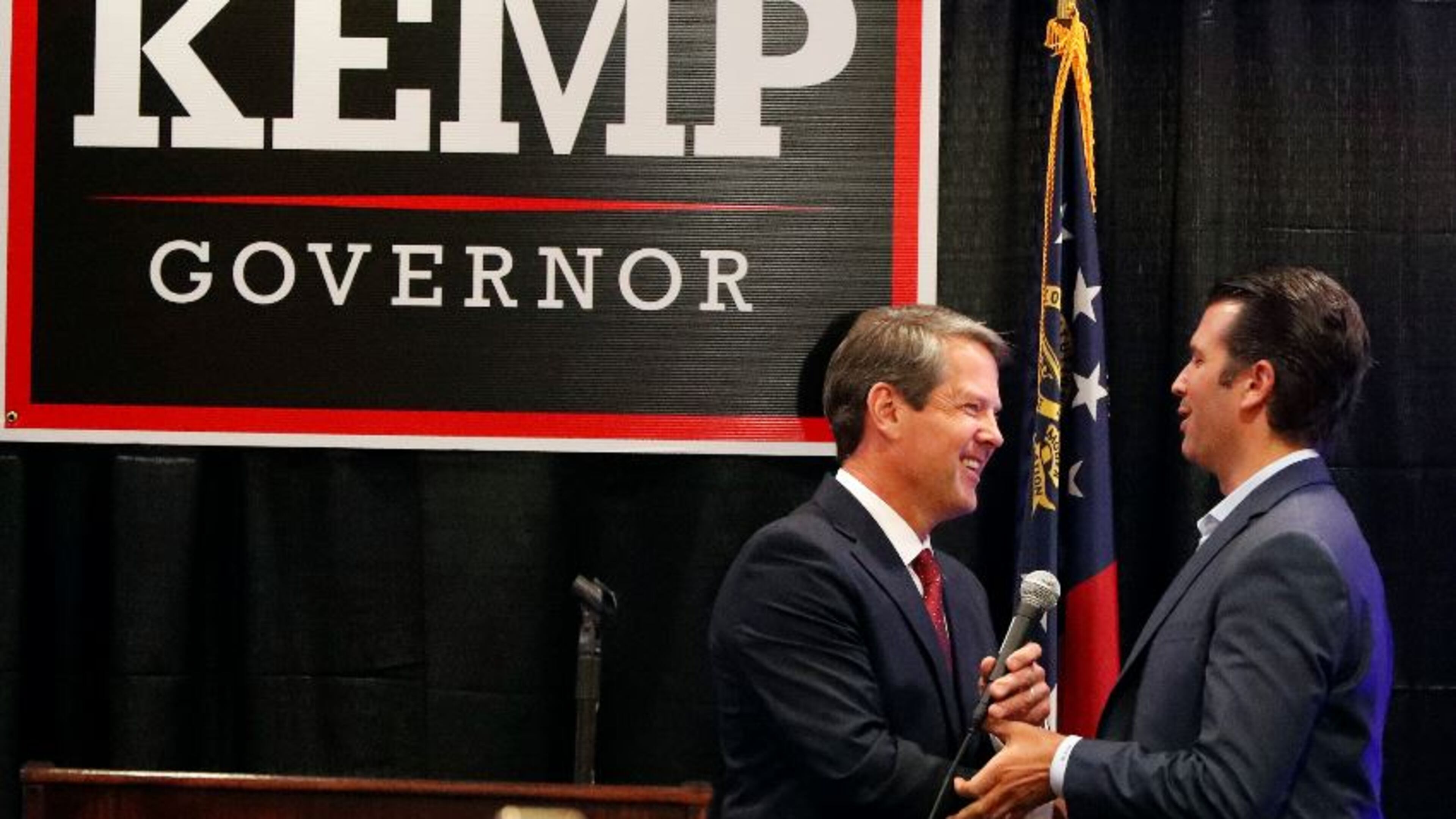 Republican gubernatorial nominee Brian Kemp, left, welcomes Donald Trump Jr on stage during a campaign event Tuesday in Athens. AP/John Bazemore