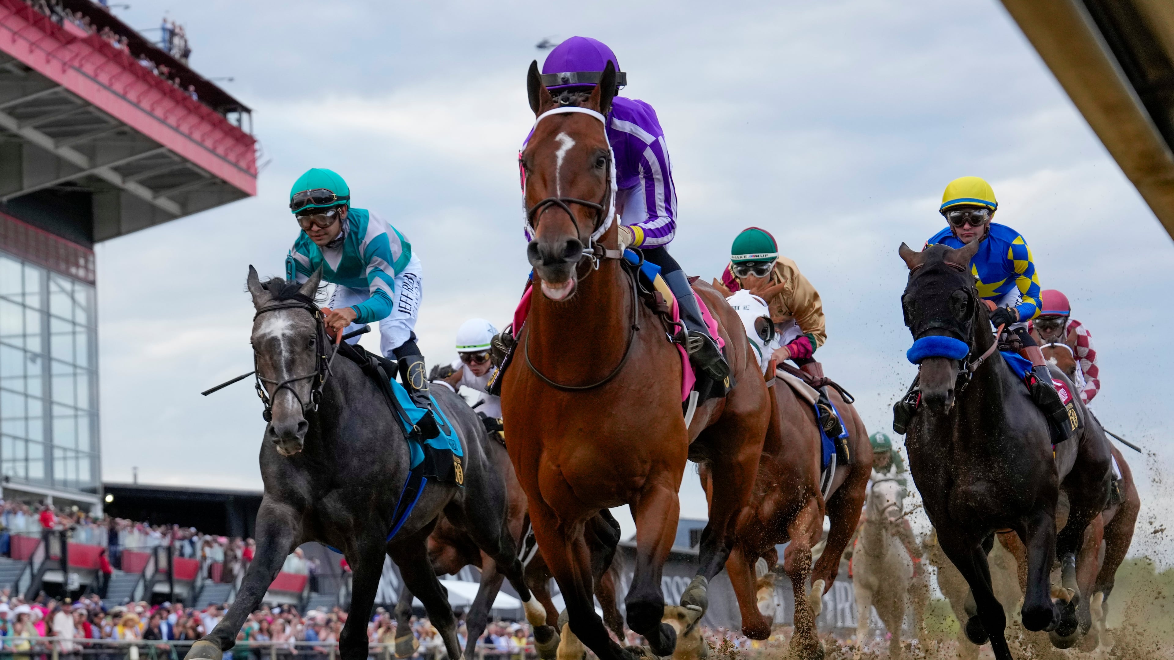 FILE - Jockeys compete during the 150th running of the Preakness Stakes horse race on May 17, 2025, at Pimlico Race Course in Baltimore. (AP Photo/Stephanie Scarbrough, File)