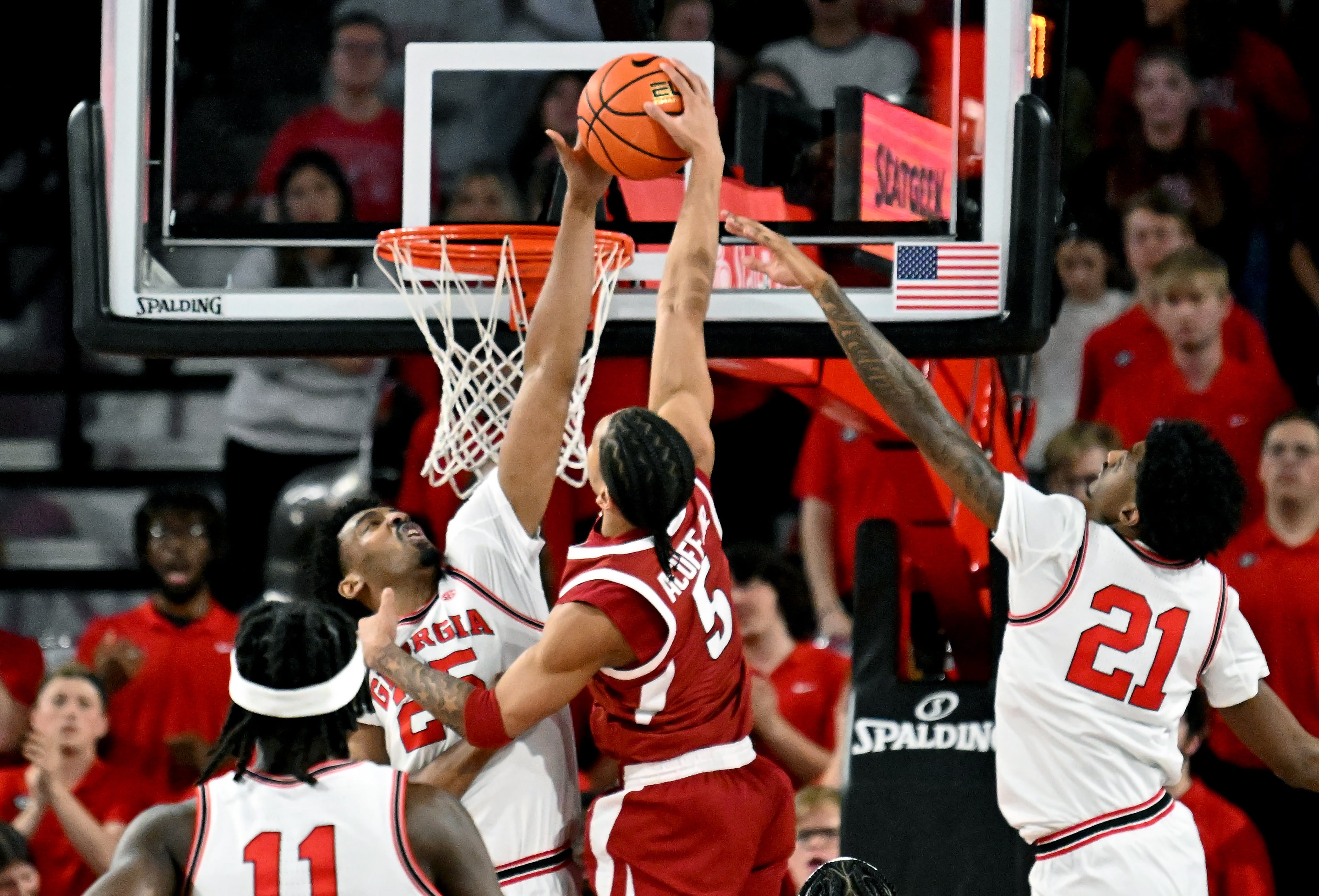 Georgia forward Justin Abson blocks the shot by Arkansas guard Darius Acuff Jr. during the second half in an NCAA college basketball game at Stegeman Coliseum, Saturday, Jan. 17, 2026, in Athens. Georgia won 90-76 over Arkansas. (Hyosub Shin/AJC)