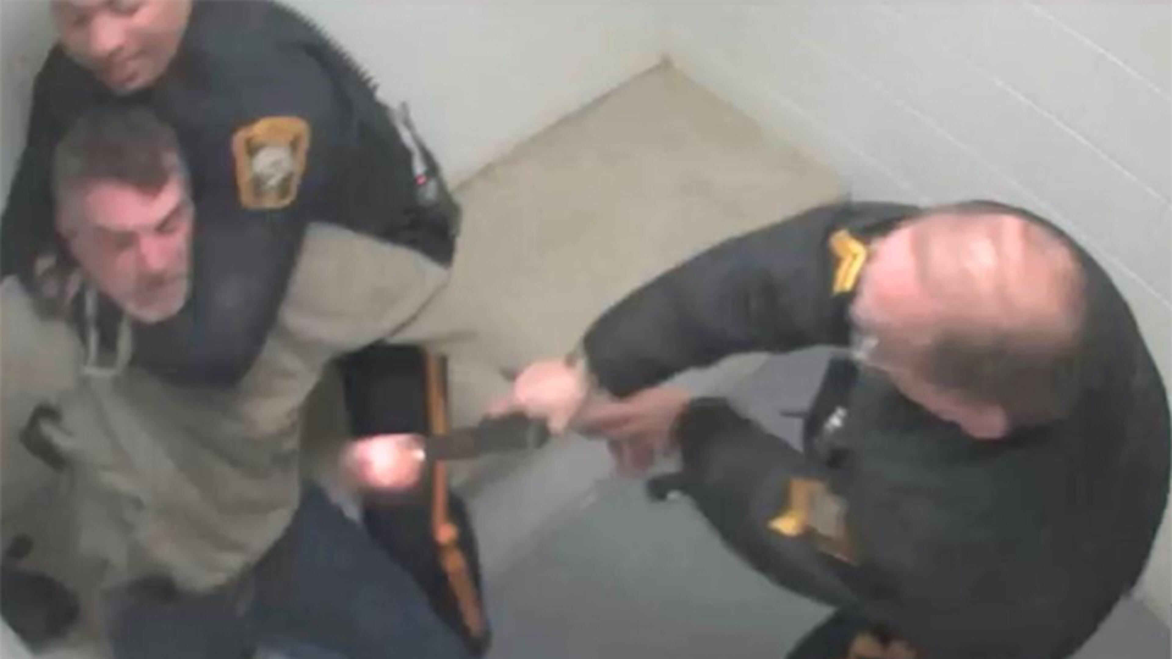 This screenshot from surveillance video released by the Bucks County District Attorney's Office shows the moment when a now-retired police officer with the New Hope Police Department in Pennsylvania mistook his service weapon for a Taser and shot a suspect in March 2019.