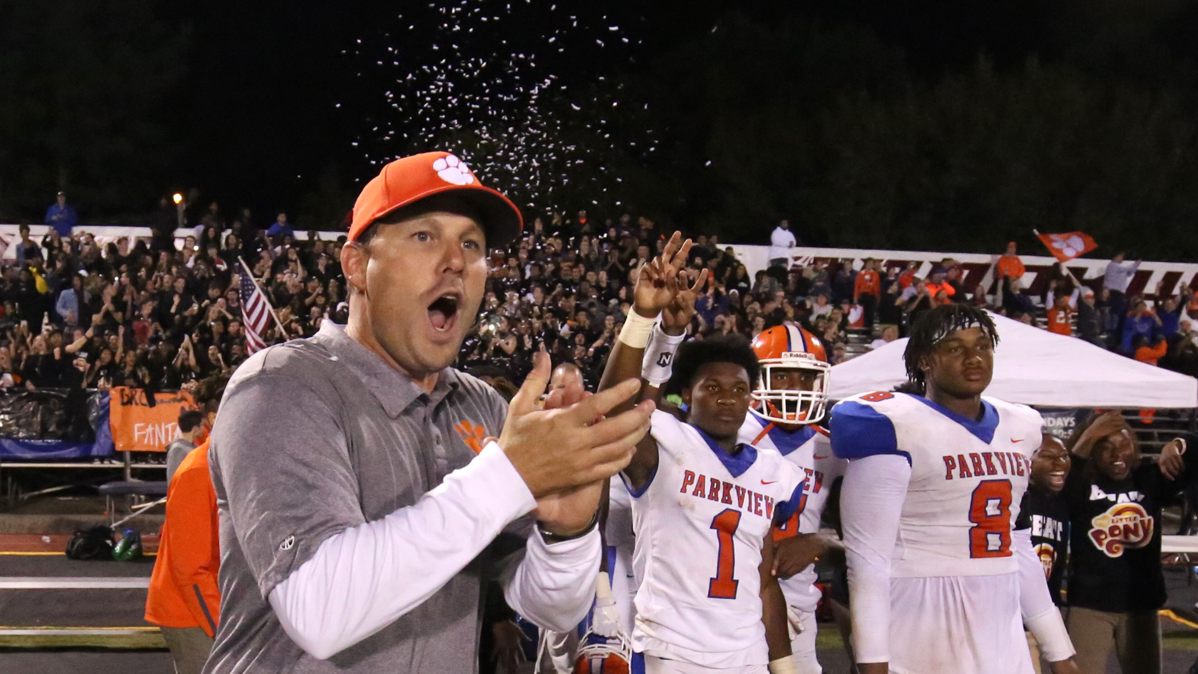 Parkview coach Eric Godfree celebrates Friday's 31-2 win over Brookwood. Also shown are Malik Washington (1) and Bryce Wilson (8). (Jason Getz/Special)