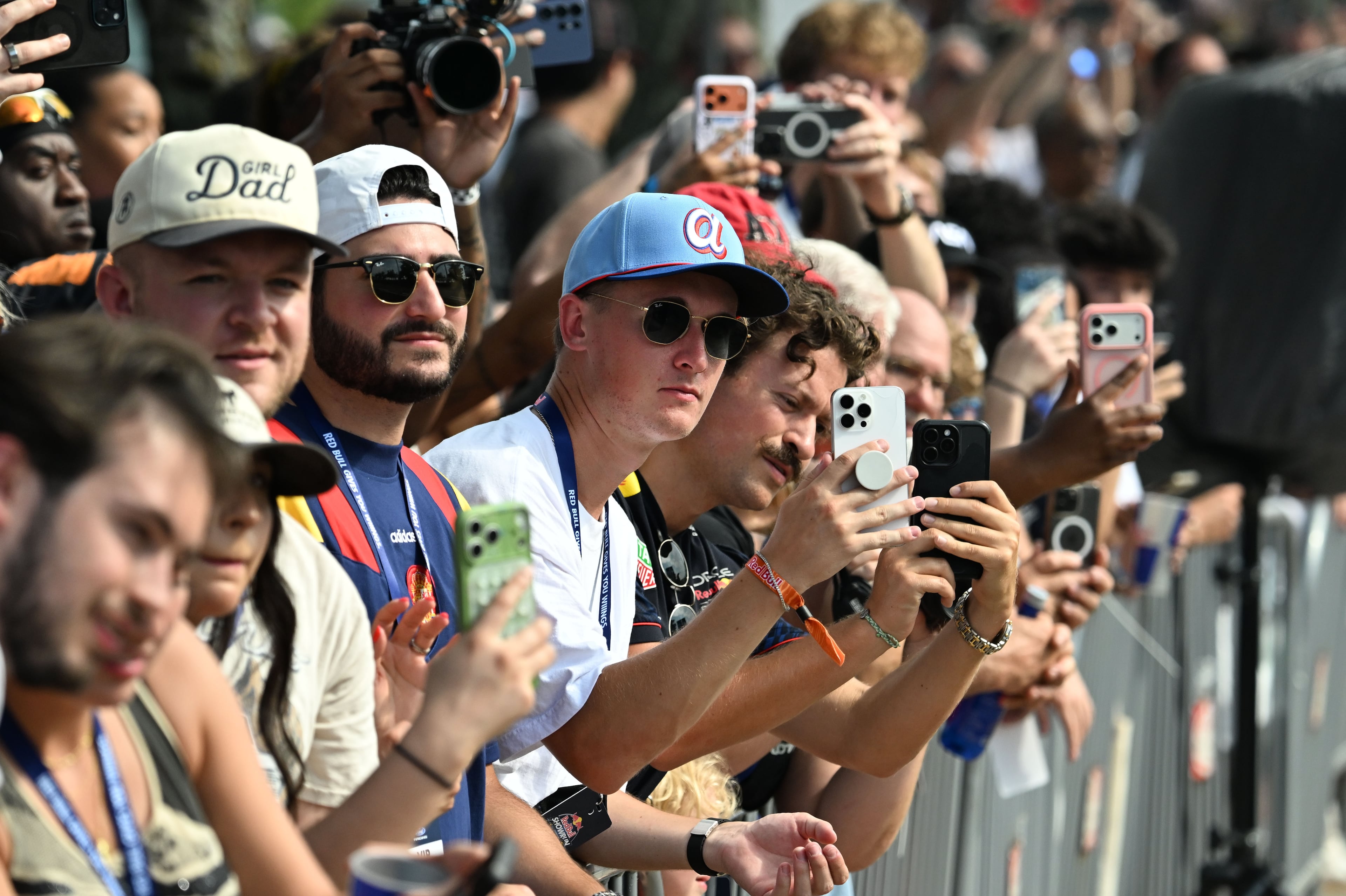 Spectators hold up their smartphones to capture a demonstration run on Hank Aaron Drive during the Red Bull Showrun Atlanta Presented by Ford Racing on Saturday, Aug. 1, 2026, in Atlanta. Atlanta city officials this week approved permits for the Red Bull Showrun that will allow the live motorsports demonstration event to go on as advertised along a roughly half-mile stretch of Hank Aaron Drive — a backup location after earlier plans to hold the event near Piedmont Park ran into opposition from Midtown residents. (Hyosub Shin/AJC)