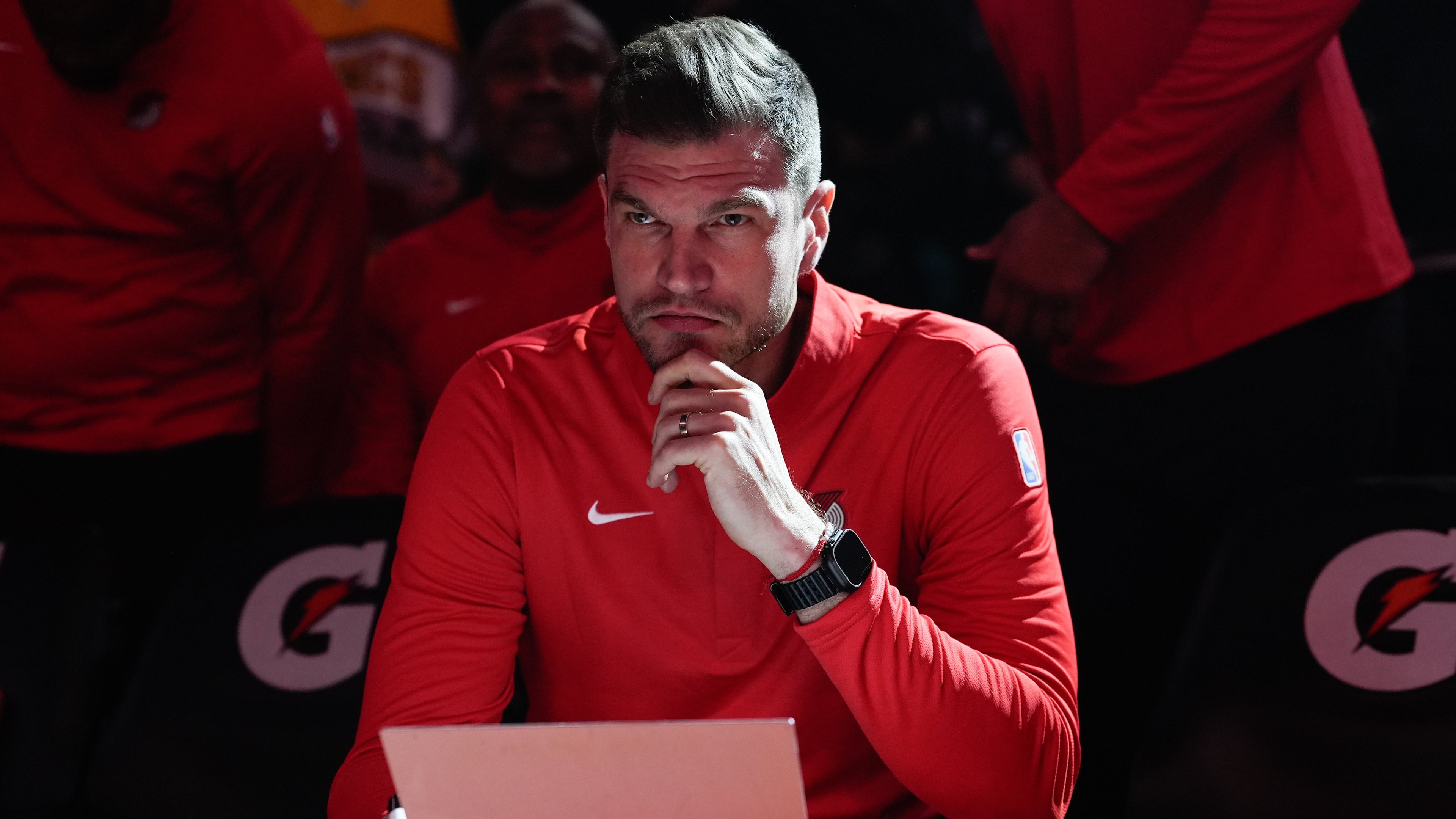 FILE - Portland Trail Blazers interim head coach Tiago Splitter listens during introductions before an NBA basketball game against the Brooklyn Nets, March 23, 2026, in Portland, Ore. (AP Photo/Jenny Kane, File)