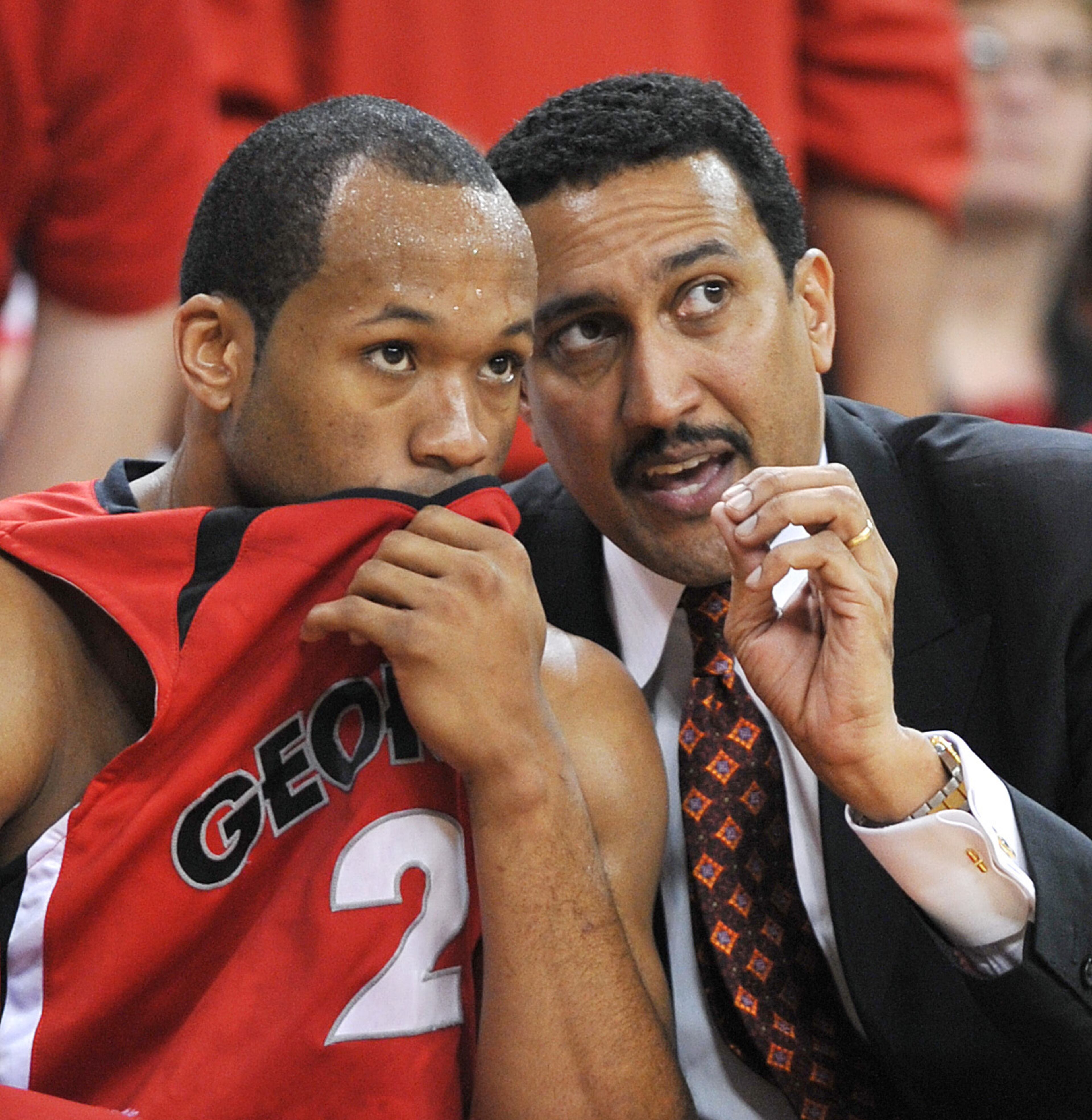 080313. ATLANTA. Georgia's head coach Dennis Felton cq gives some instruction on the bench to player Sundiata Gaines cq in their 64-60 win over Mississippi State in their semi-final game in the SEC Men's Basketball Tournament, which was moved Saturday to Georgia Tech's Alexander Memorial Coliseum, after Friday's tornado shut down the Georgia Dome. Rich Addicks / AJC