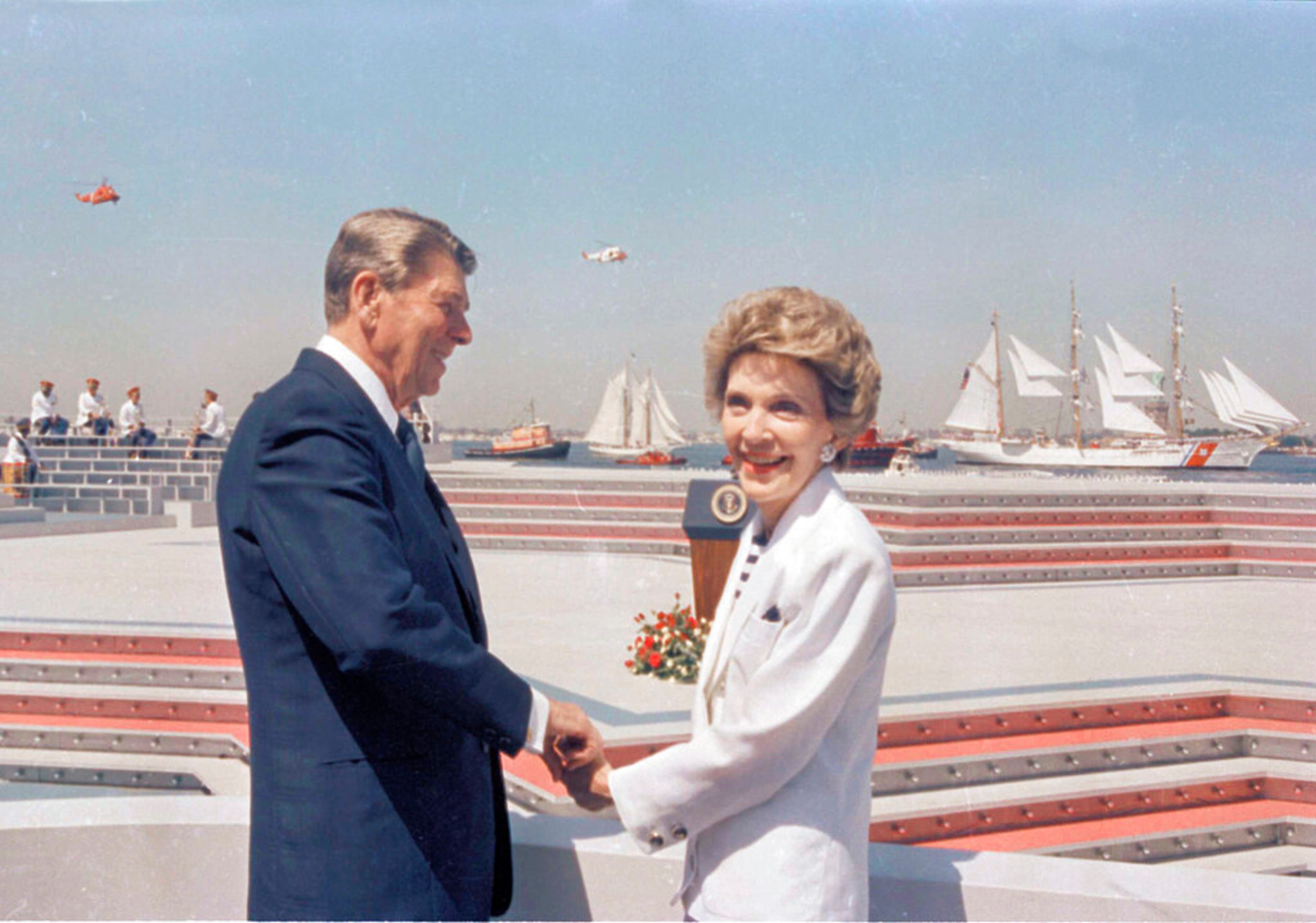 FILE - In this July 4, 1986 file photo, President Ronald Reagan and first lady Nancy Reagan hold hands as they watch the start of Op Sail from Governor's Island in New York Harbor. (AP Photo/Ira Schwarz)