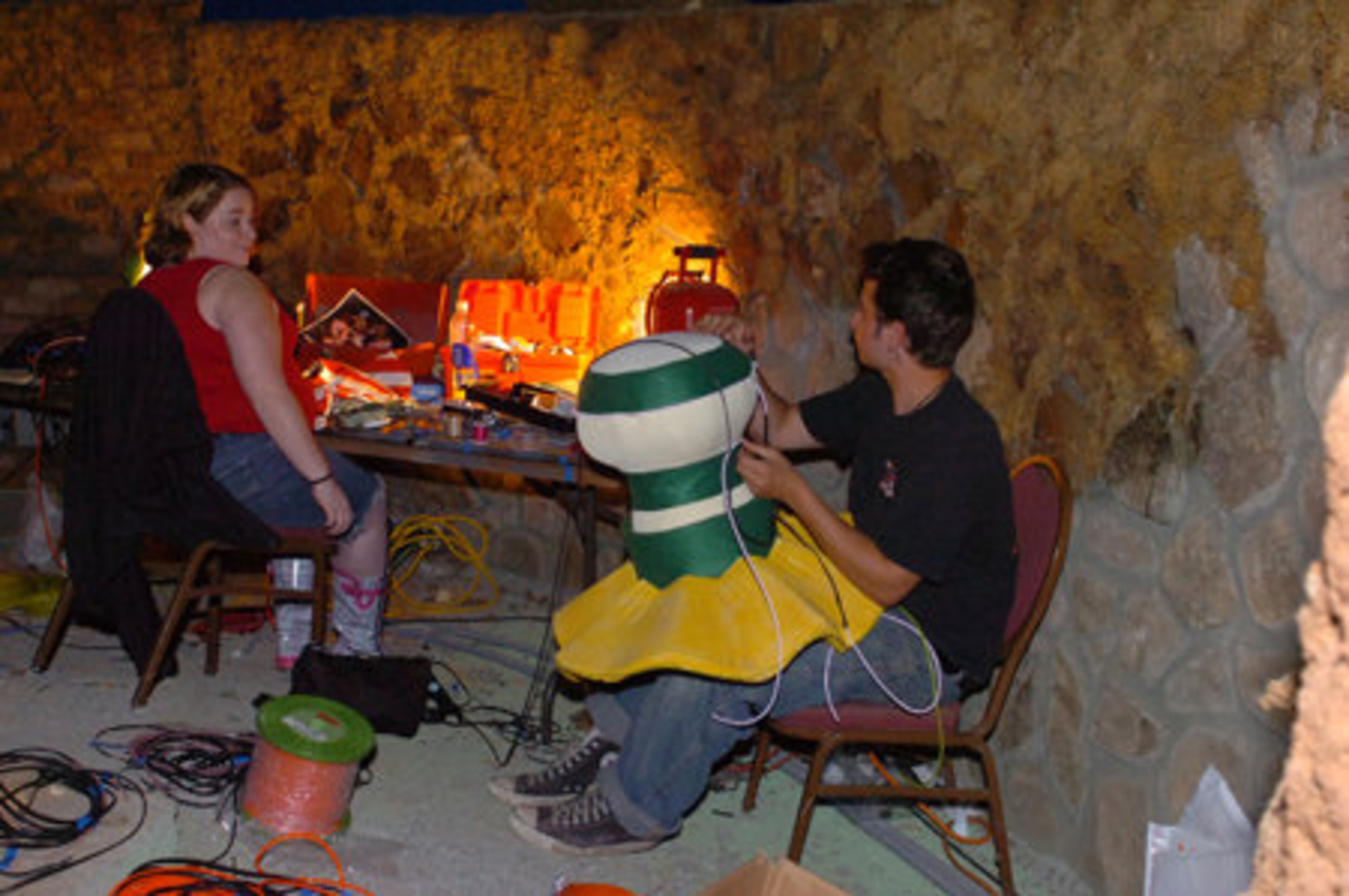 Kate McNeely and Ryan Sbaratta work on lighting a character in the Monster Band. The 25,000-square-foot mansion got new music recordings, backdrops, audio system and lights during the renovation.