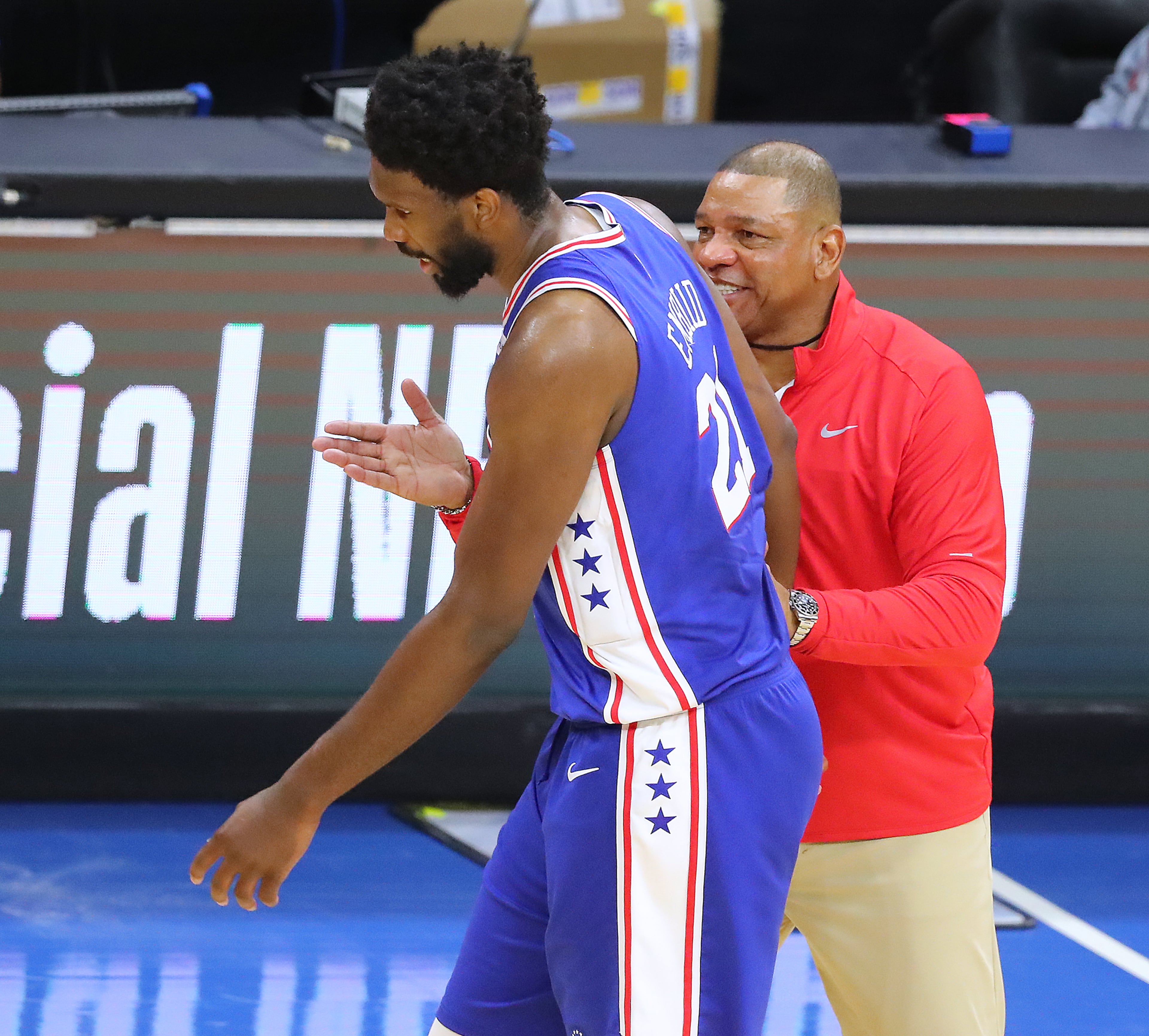 Philadelphia 76ers head coach Doc River pats center Joel Embiid on the chest celebrating in the final minutes of a 118-102 victory. “Curtis Compton / Curtis.Compton@ajc.com”