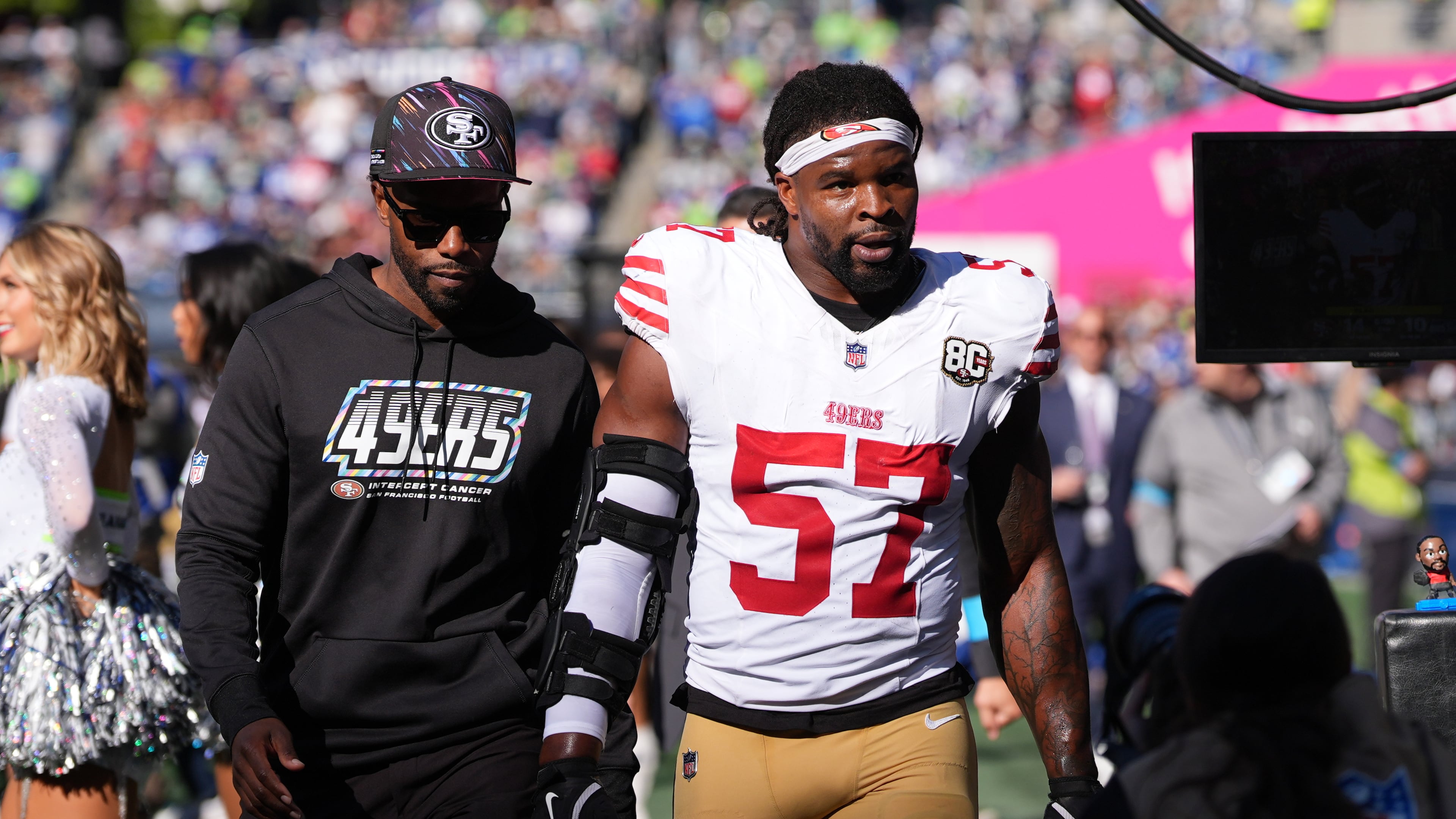 San Francisco 49ers linebacker Dre Greenlaw (57) leaves the field after being ejected during the first half of an NFL football game against the Seattle Seahawks, Sunday, Oct. 11, 2026, in Seattle. (AP Photo/Lindsey Wasson)