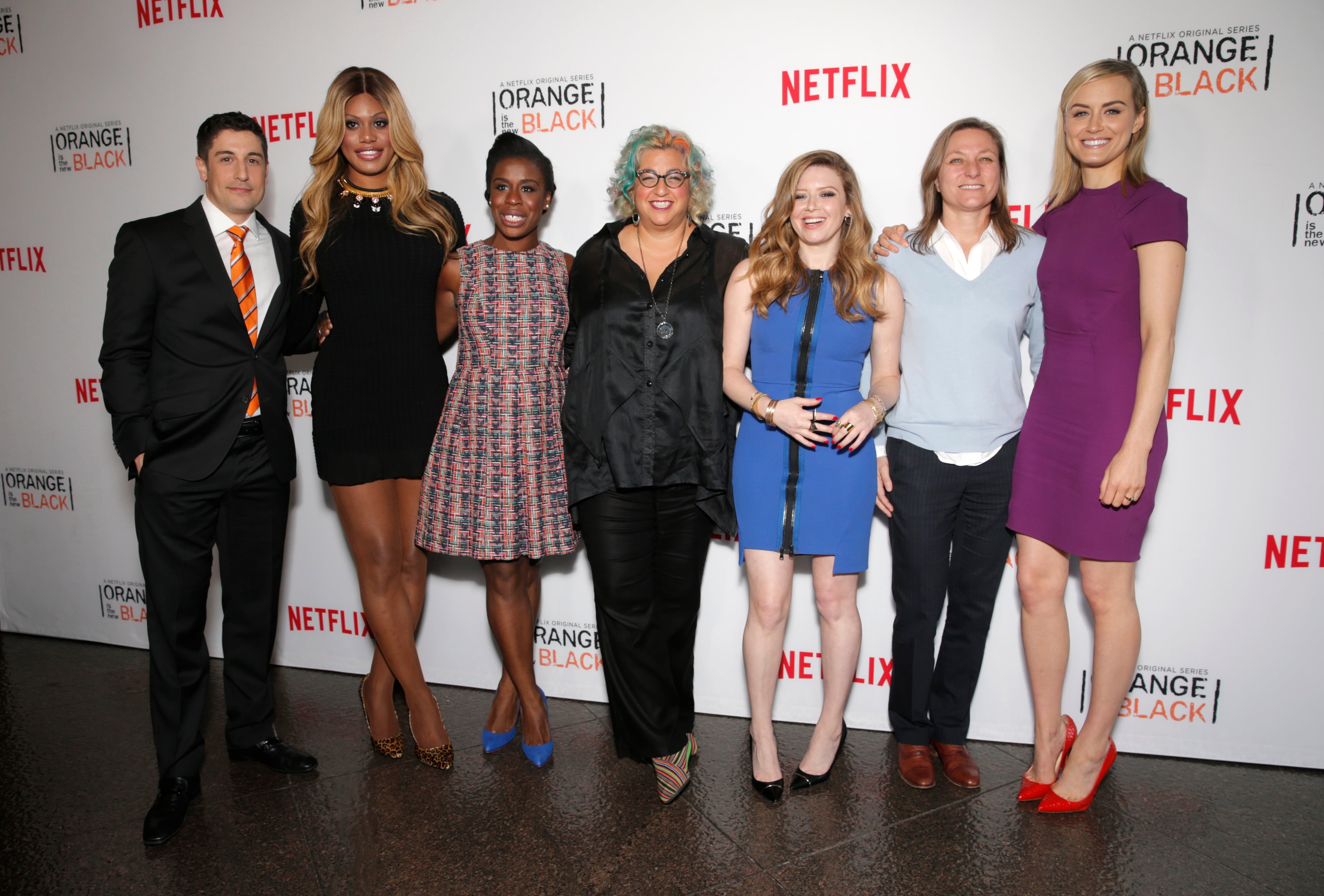 Jason Biggs, from left, Laverne Cox, Uzo Aduba, writer Jenji Kohan, Natasha Lyonne, Cindy Holland and Taylor Schilling arrive at a panel discussion with the cast of "Orange Is The New Black" at the Directors Guild of America Theater on Monday, Aug. 4, 2014, in Los Angeles. (Photo by Todd Williamson/Invision/AP)