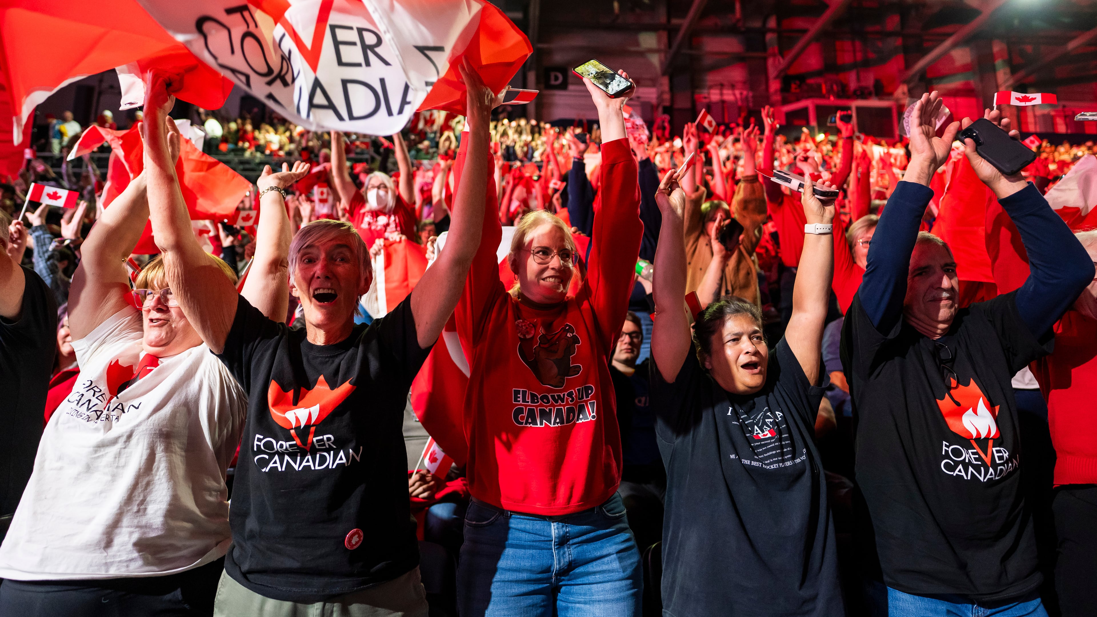 People cheer at a Forever Canadian rally in Edmonton, on Friday, Oct. 16, 2026. (John Ulan/The Canadian Press via AP)