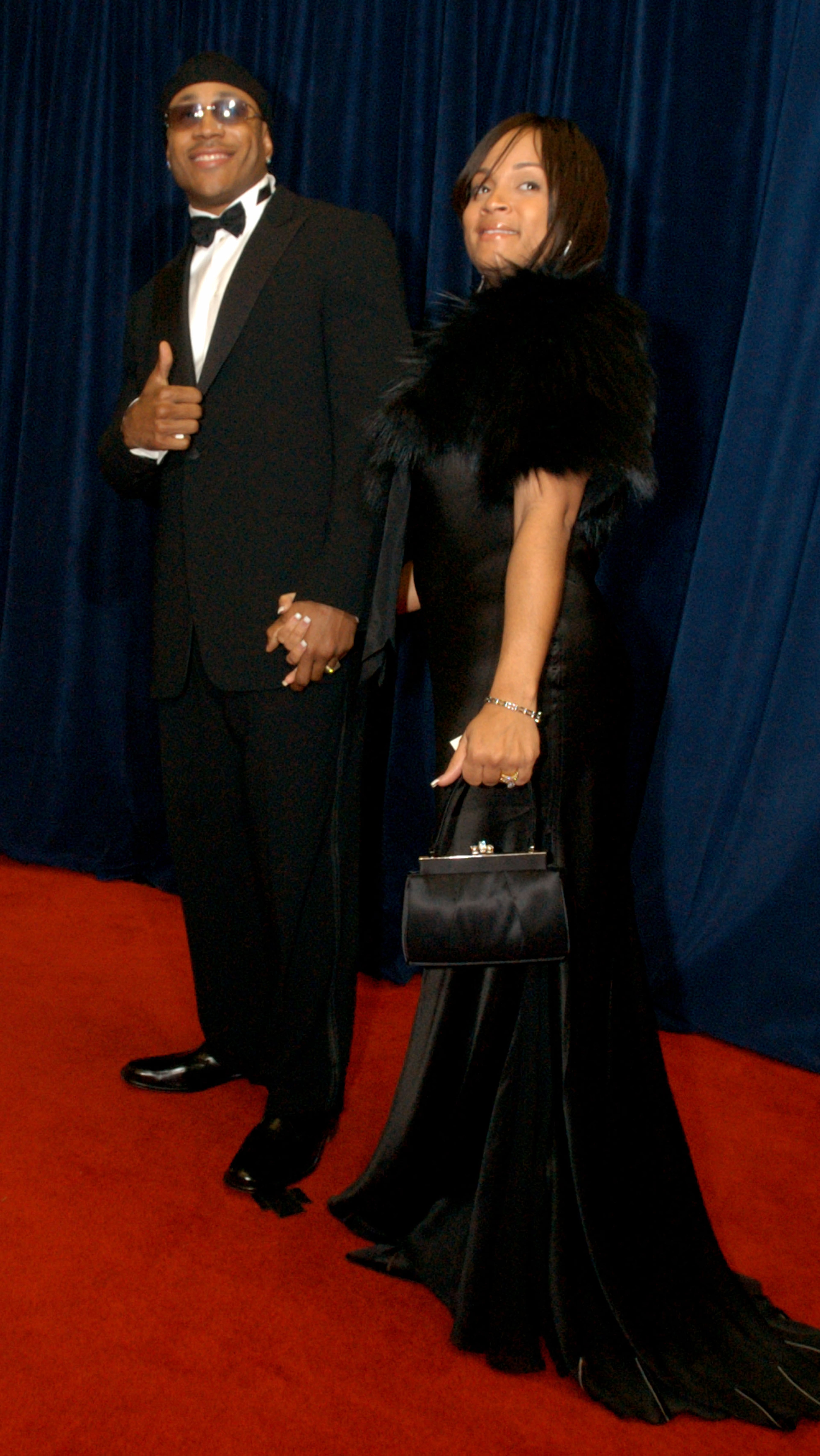 LL Cool J and his wife Simone arrive at the State Dept. in Washington, Saturday, Dec. 6, 2003 for a reception for the honorees for the Kennedy Center the 26th national celebration of the arts. The Kennedy Center Honorees are being honored for thier unique contributions to the cultural life of our nation. (AP Photo/ Jacqueline Roggenbrodt Malonson )