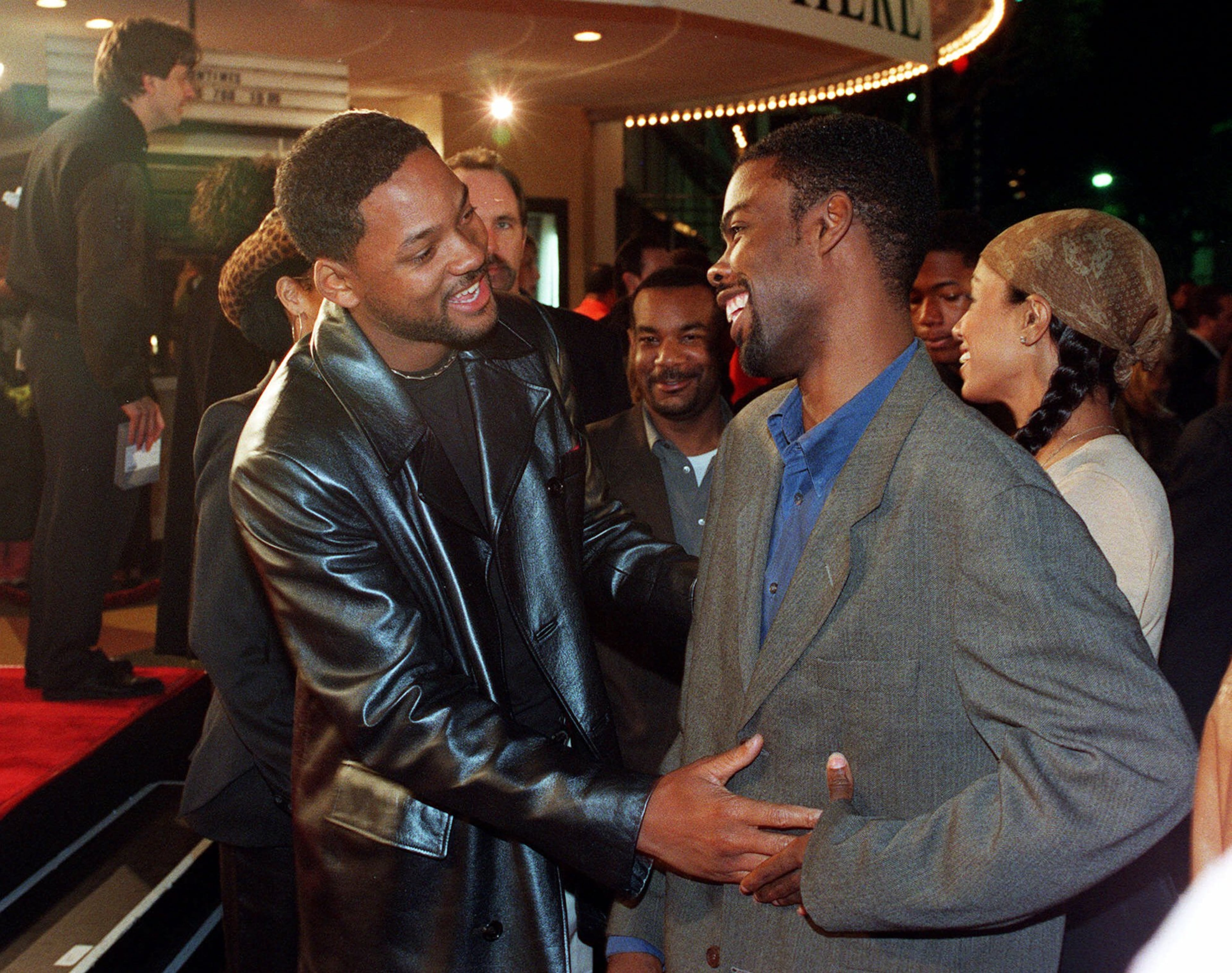 Will Smith, left, and comedian Chris Rock joke around prior to the world premiere of "The Matrix" Wednesday, March 24, 1999, in the Westwood section of Los Angeles. "The Matrix" is a futuristic action thriller starring Keanu Reeves and Laurence Fishburne. (AP Photo/Rene Macura)