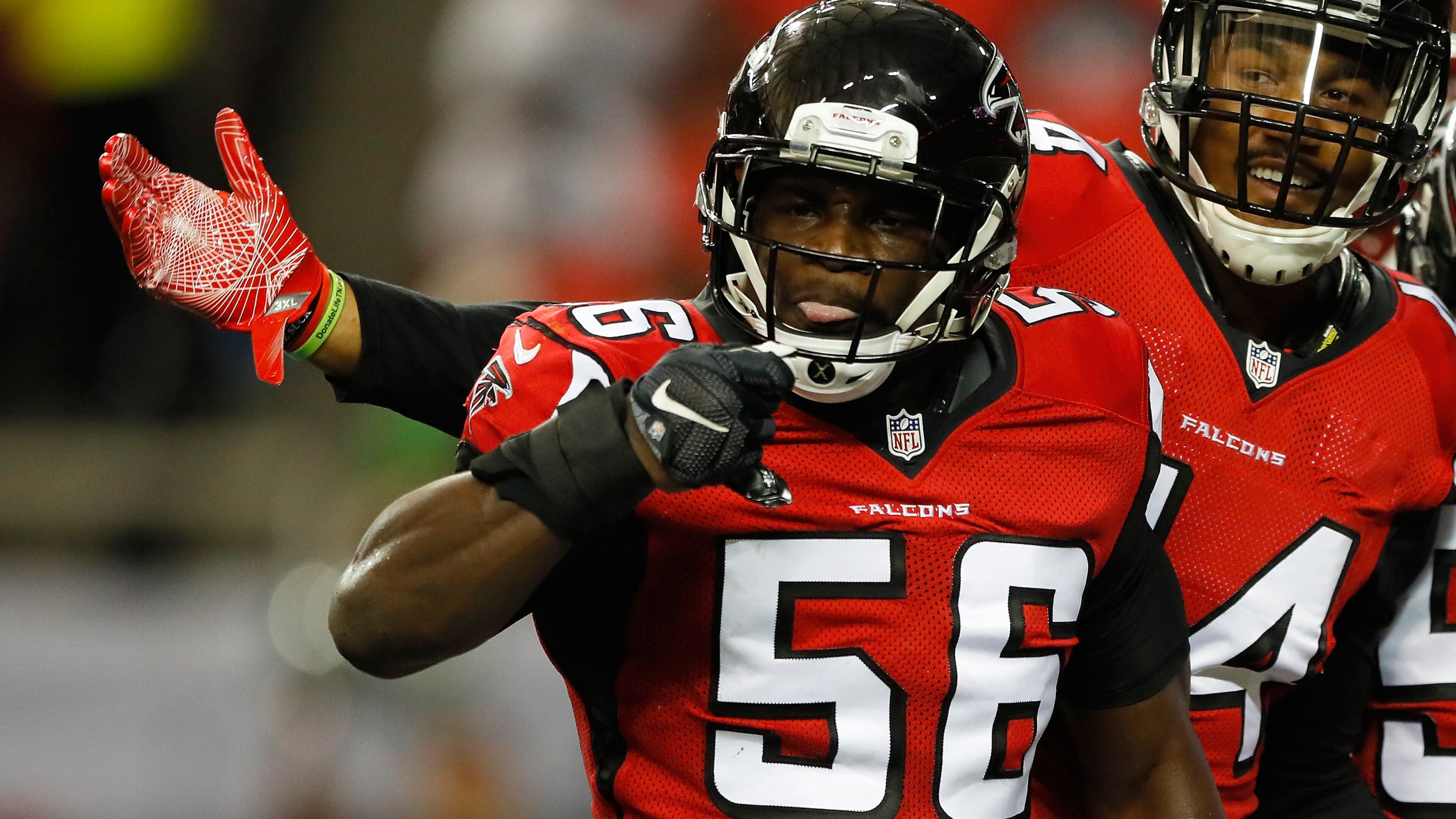 ATLANTA, GA - AUGUST 11: Sean Weatherspoon #56 of the Atlanta Falcons reacts with Vic Beasley #44 after a tackle against the Washington Redskins at Georgia Dome on August 11, 2016 in Atlanta, Georgia. (Photo by Kevin C. Cox/Getty Images)